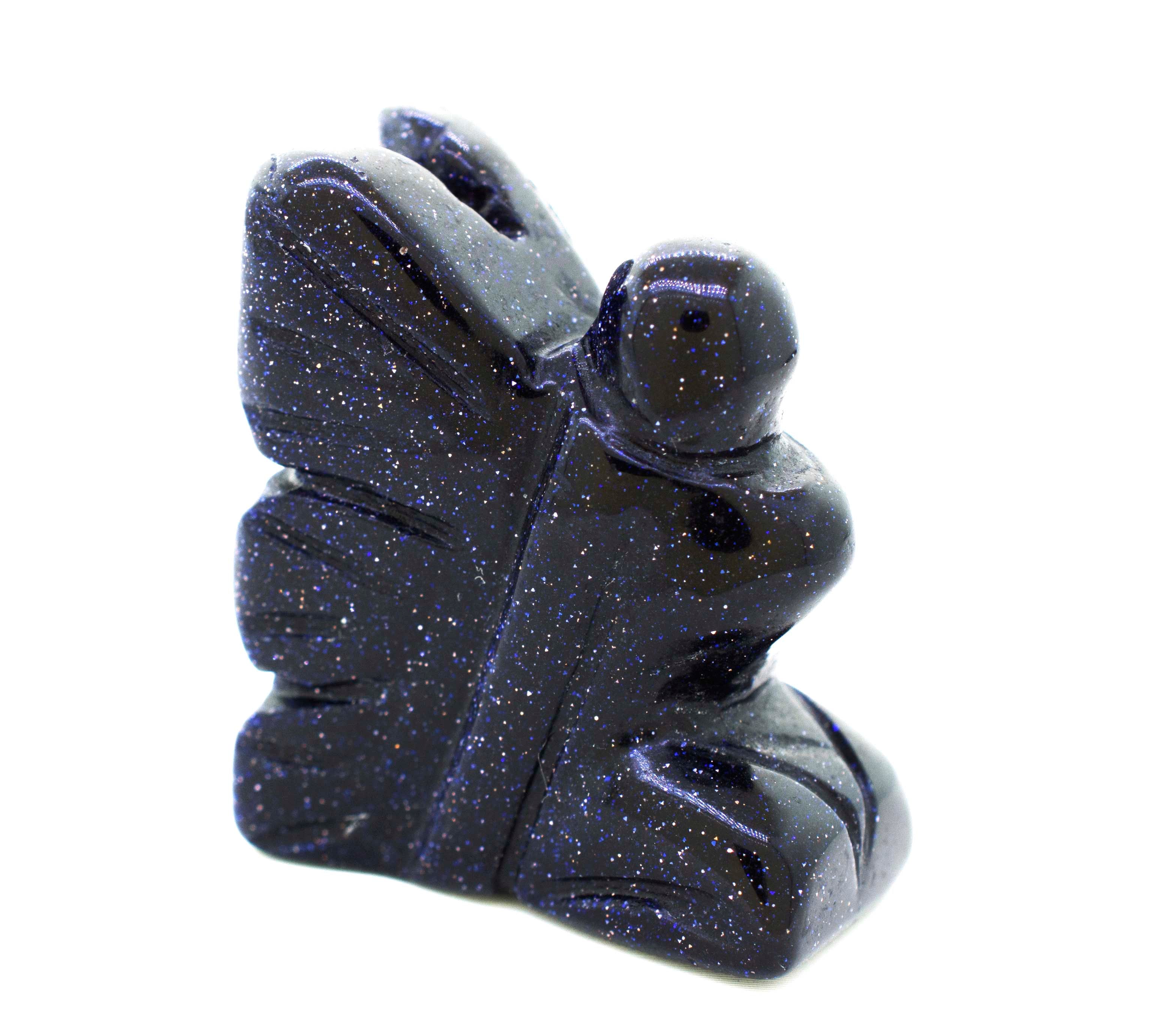 A Carved Fairy Gemstones Figure with a butterfly on it, giving off a whimsical and cottagecore vibe.