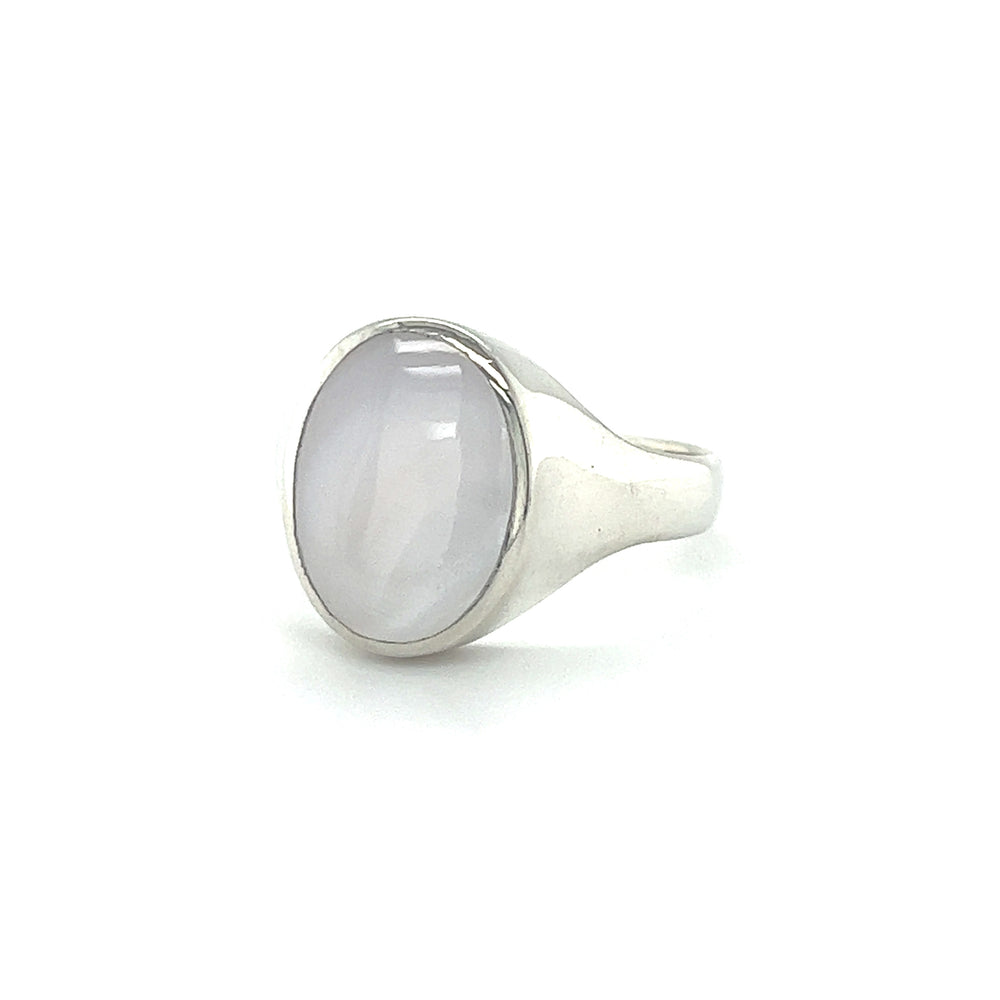 
                  
                    A Sleek Oval Inlaid Stone Signet Ring on a white background.
                  
                