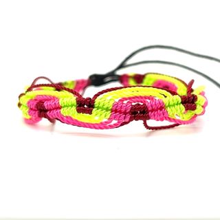 An adjustable Colorful Friendship Bracelet by Super Silver on a white surface.