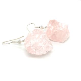 A pair of Super Silver Raw Crystal Earrings on a white background.