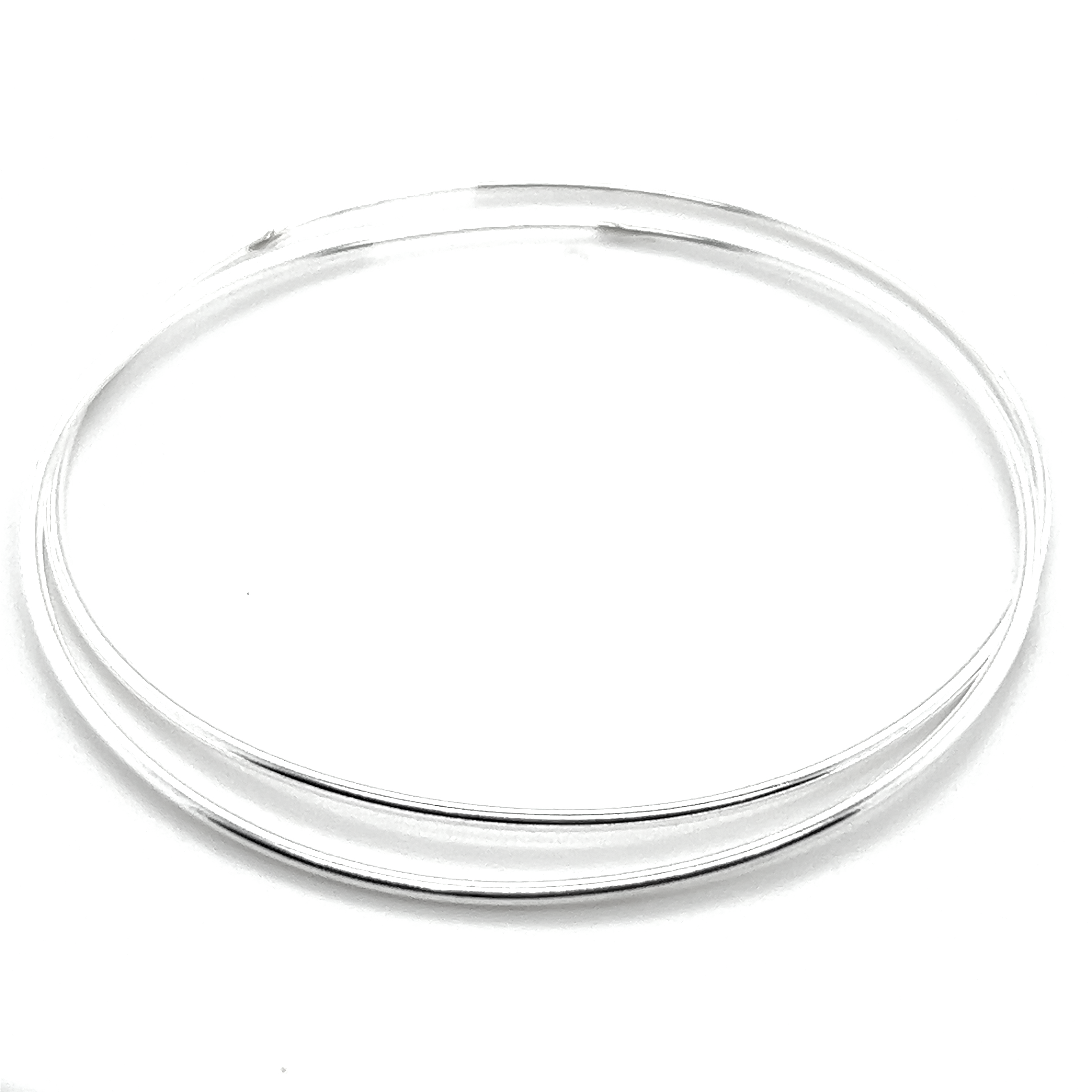 The 1.2mm Infinity Hoops, intricately crafted from .925 Sterling Silver, rest against a white background, highlighting their sophisticated intertwined bangle design.