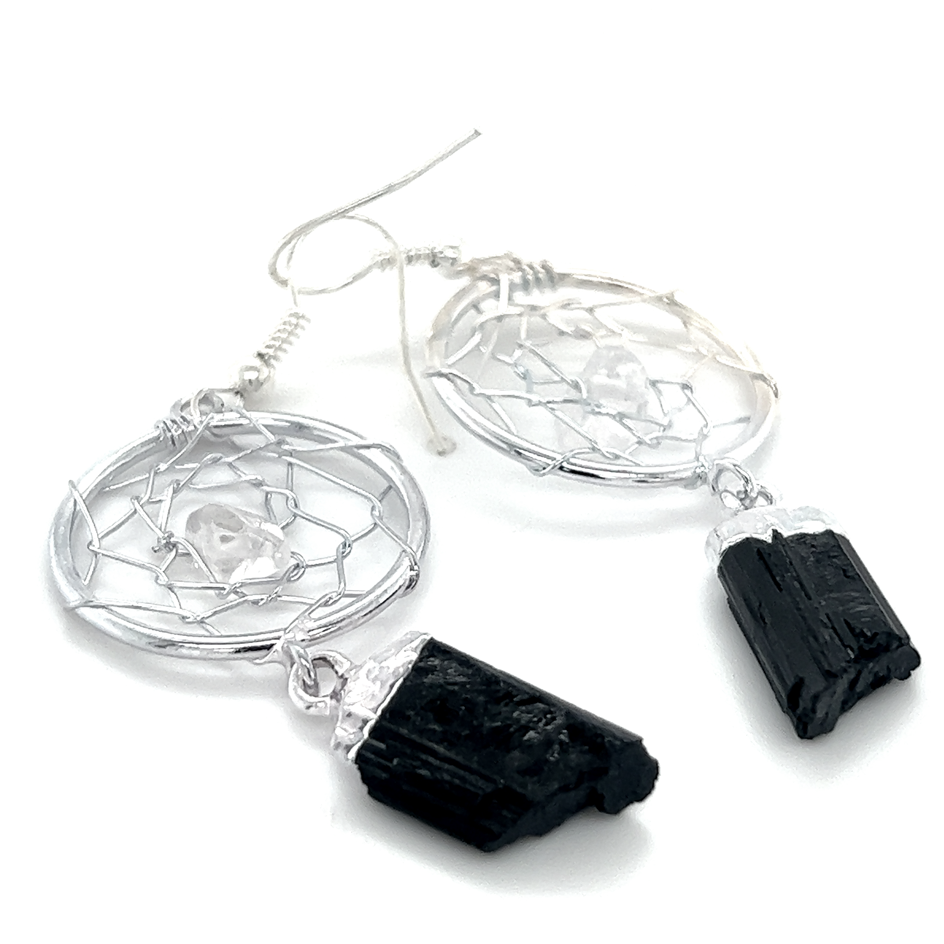 A pair of Raw Crystal Dream Catcher Earrings by Super Silver on a white background, showcasing boho elegance.
