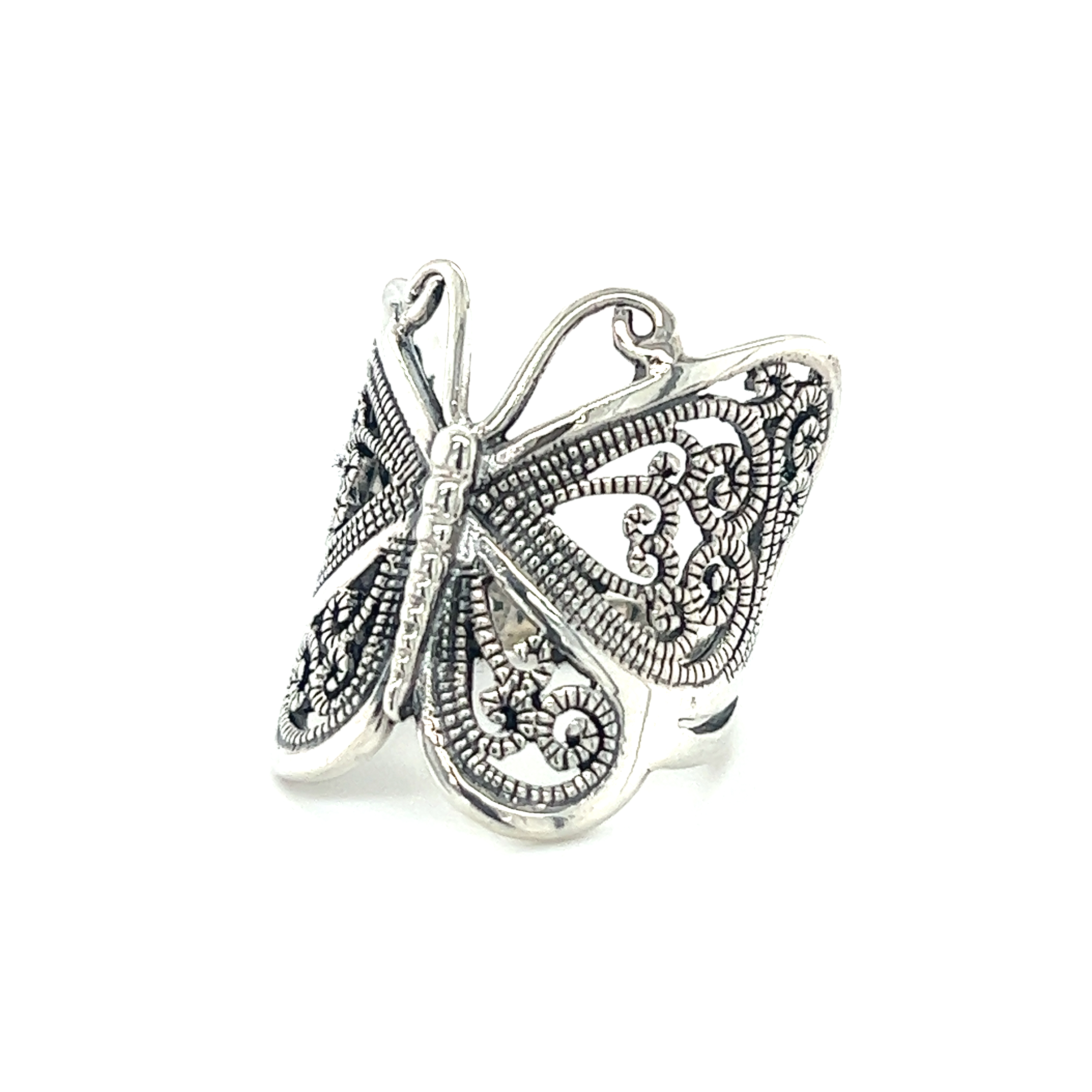 A large silver butterfly ring with an intricate filigree design.