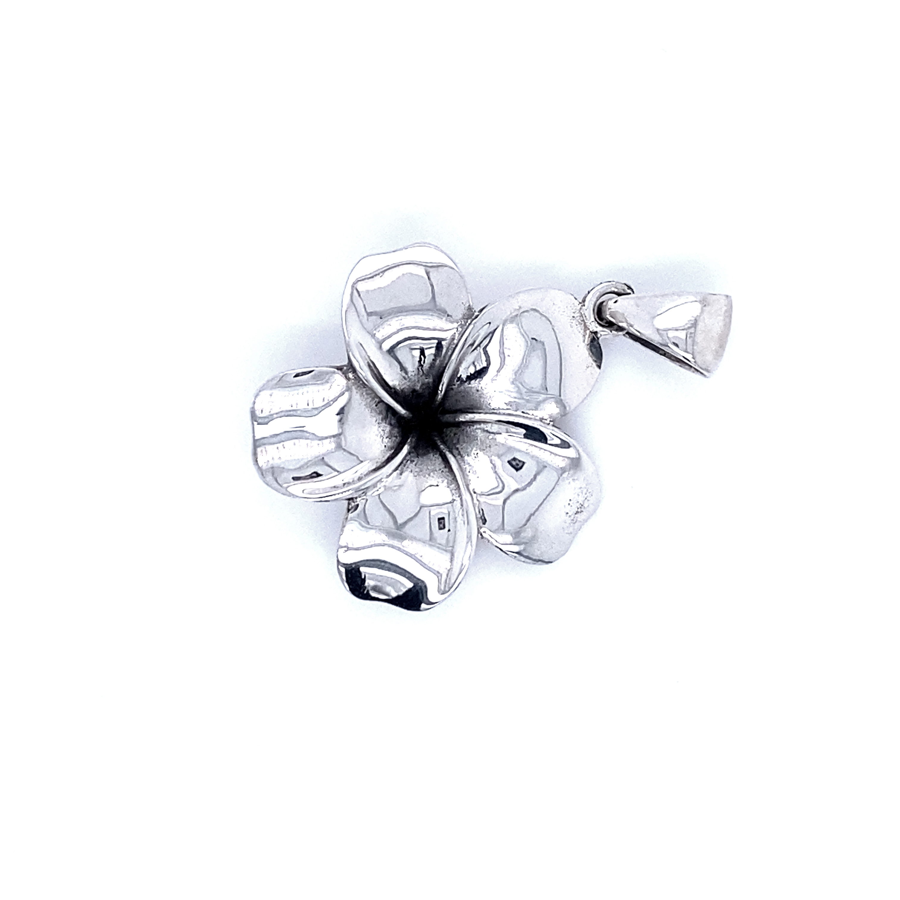A Beautiful Plumeria Pendant from Super Silver gleaming silver on a white background, capturing nature's elegance and symbolizing new beginnings.
