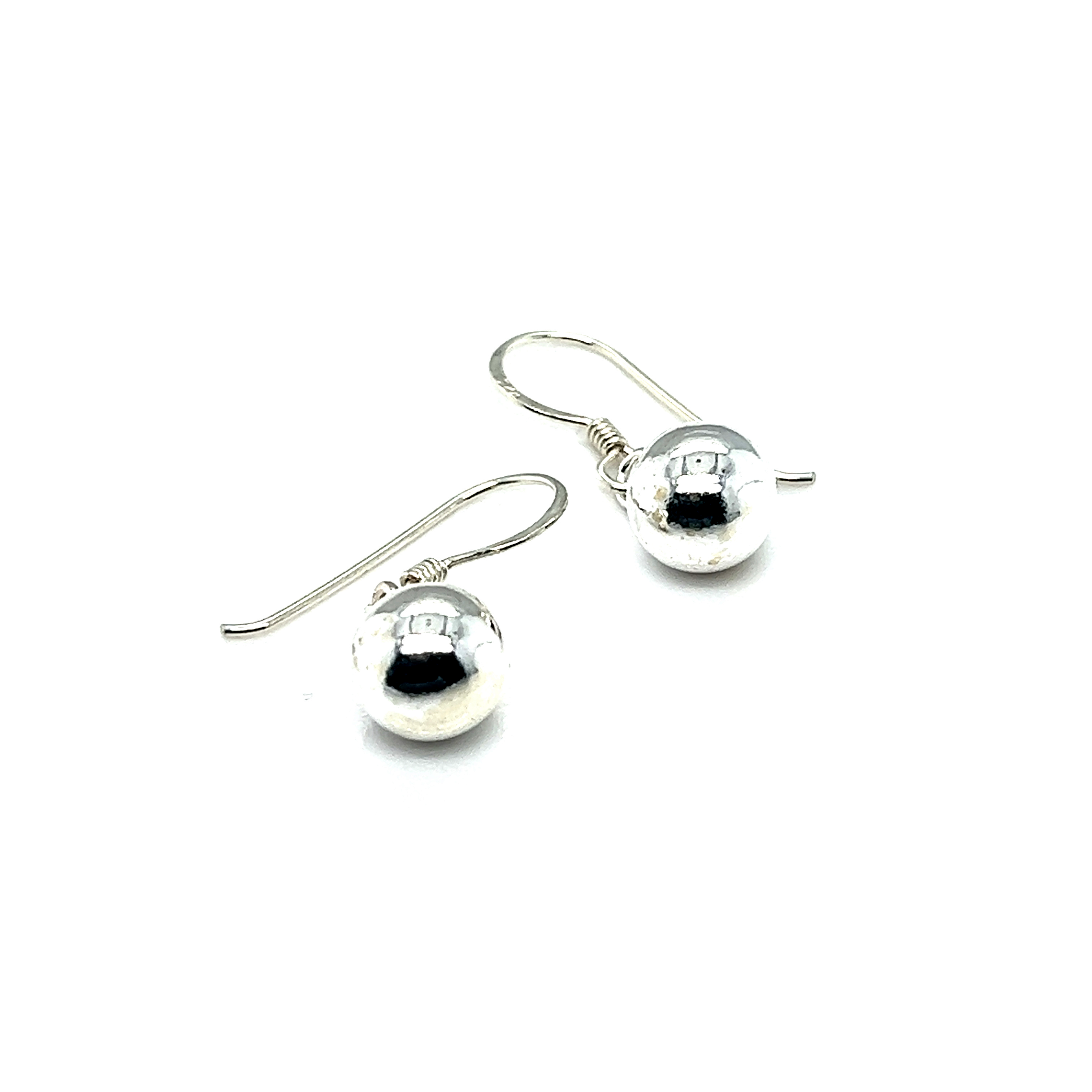 A pair of Super Silver Simple Dangling Ball Earrings, exuding understated glamour, set against a white background.