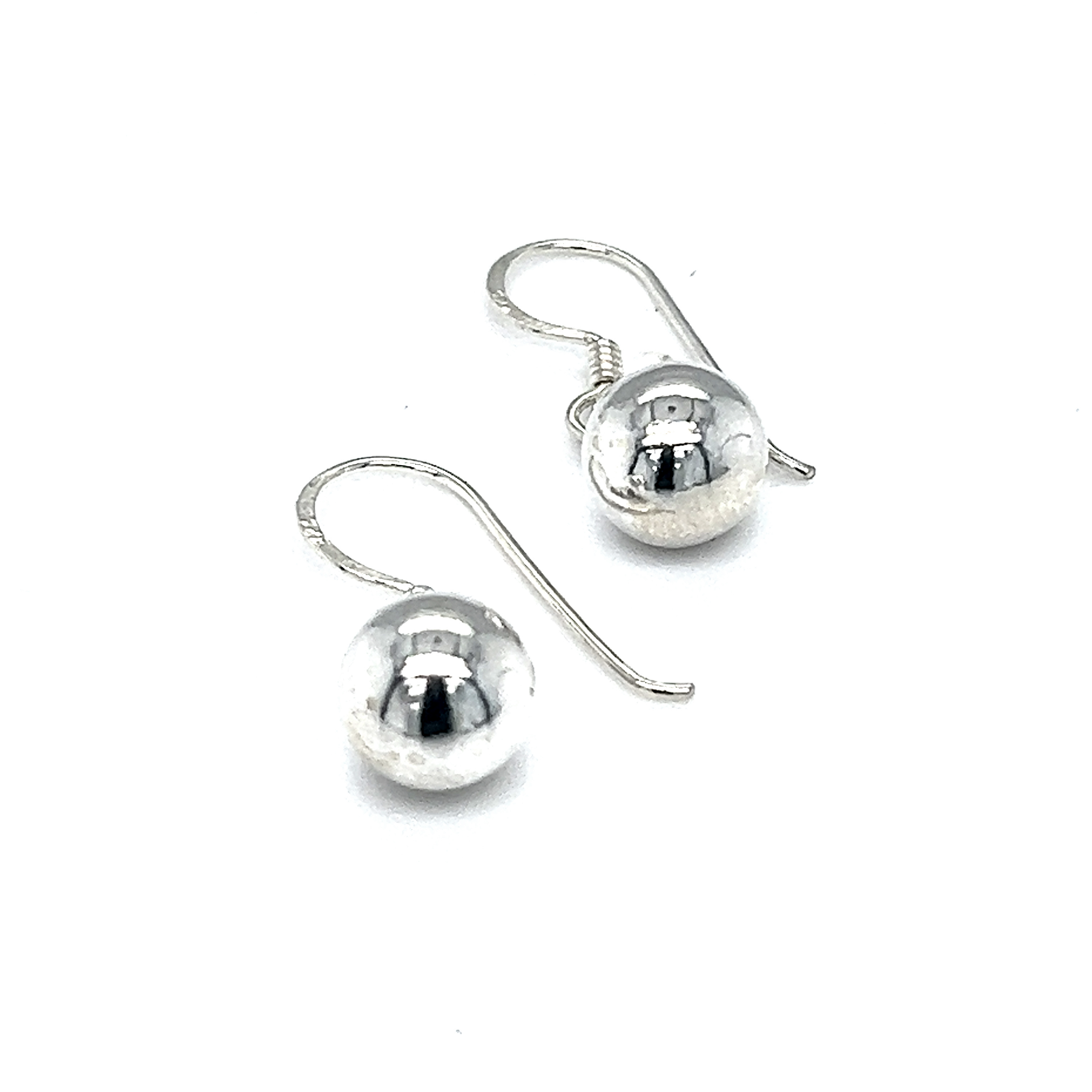 A pair of chic Super Silver Simple Dangling Ball Earrings on a white background.