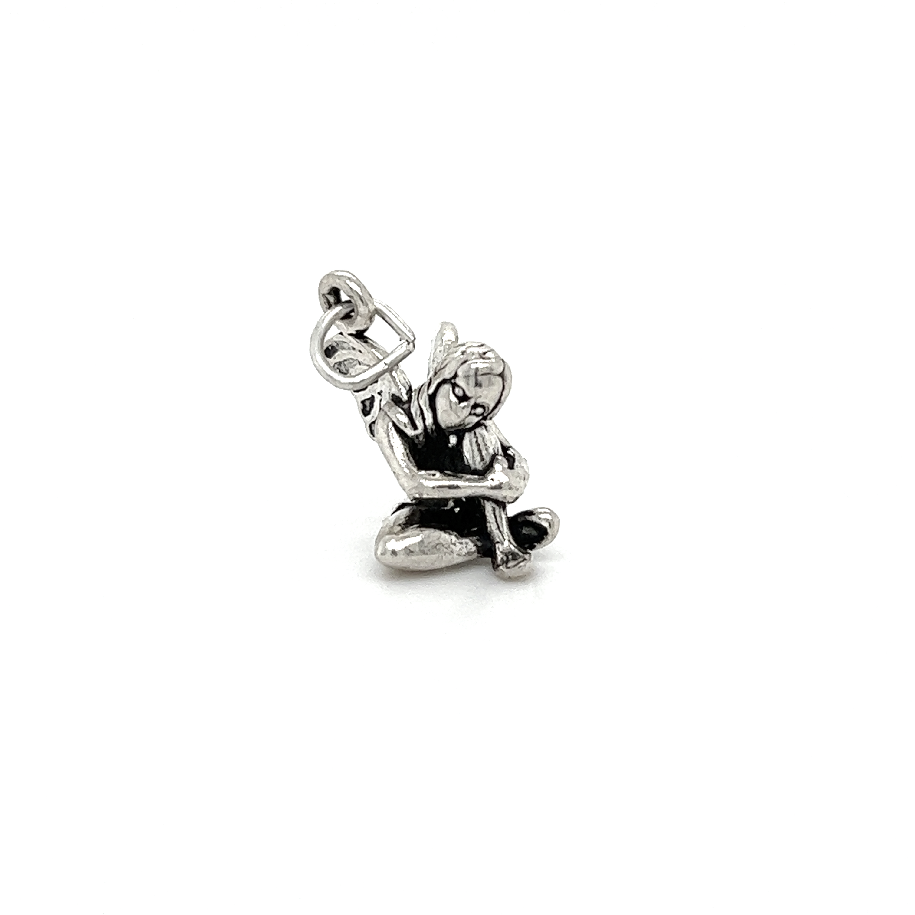 An enchanted Super Silver Fairy Charm with a little boy sitting on it, radiating magic.