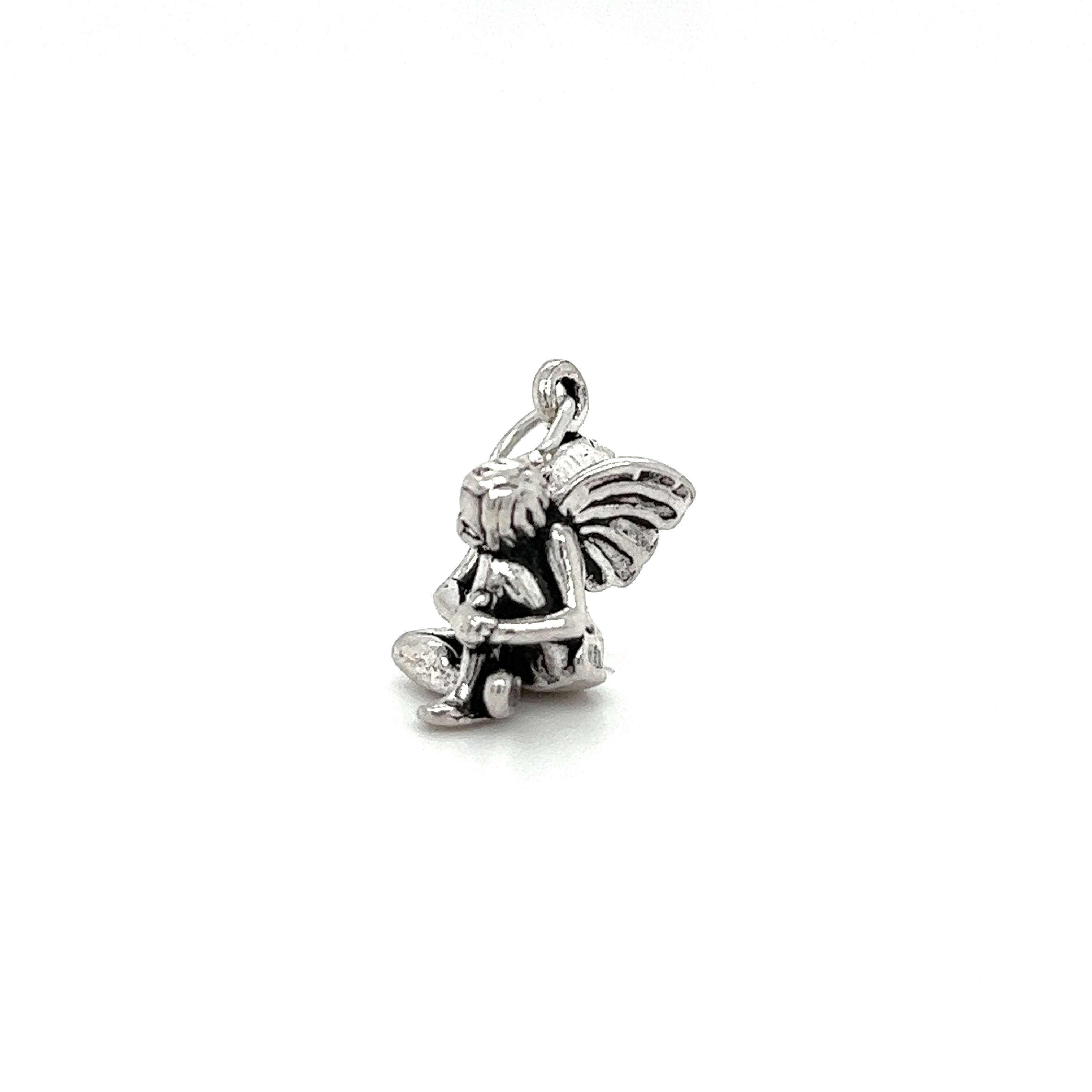 A small Super Silver Fairy Charm with a teddy bear on it, infused with enchantment.