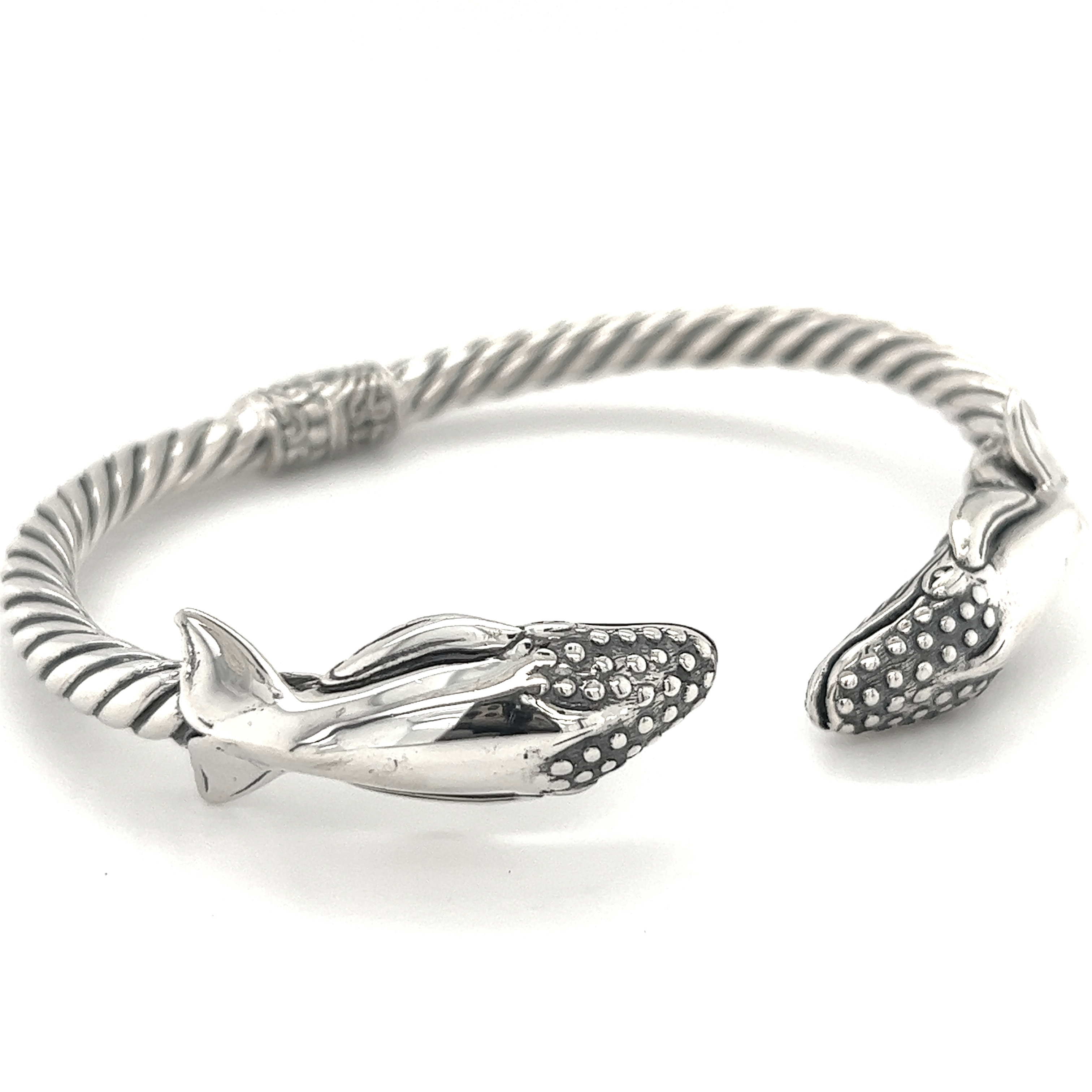 A Super Silver Exquisite Whale Hinge Bracelet with two dolphins on it.