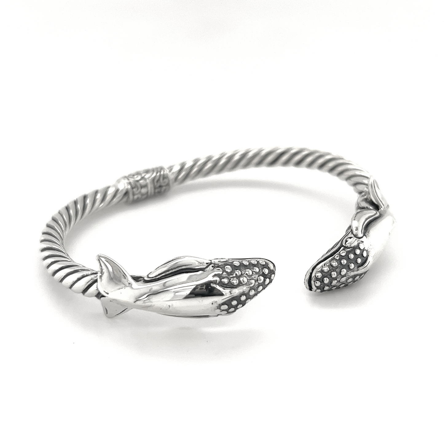 An Exquisite Whale Hinge Bracelet with a pair of dolphins, inspired by the beauty of the ocean in Santa Cruz, by Super Silver.