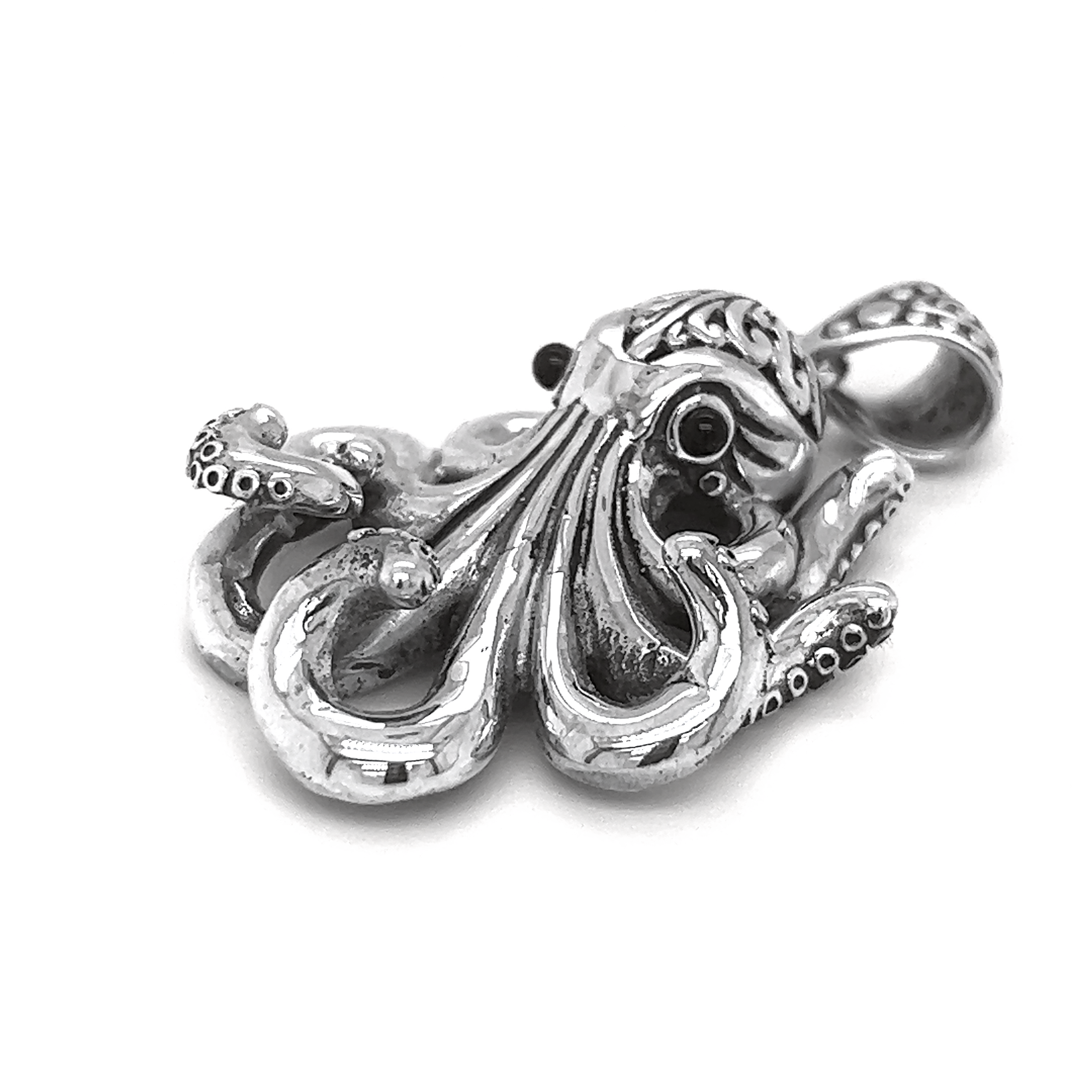 An exquisite silver Octopus Pendant representing the ocean's mysteries, showcased against a pristine white background.