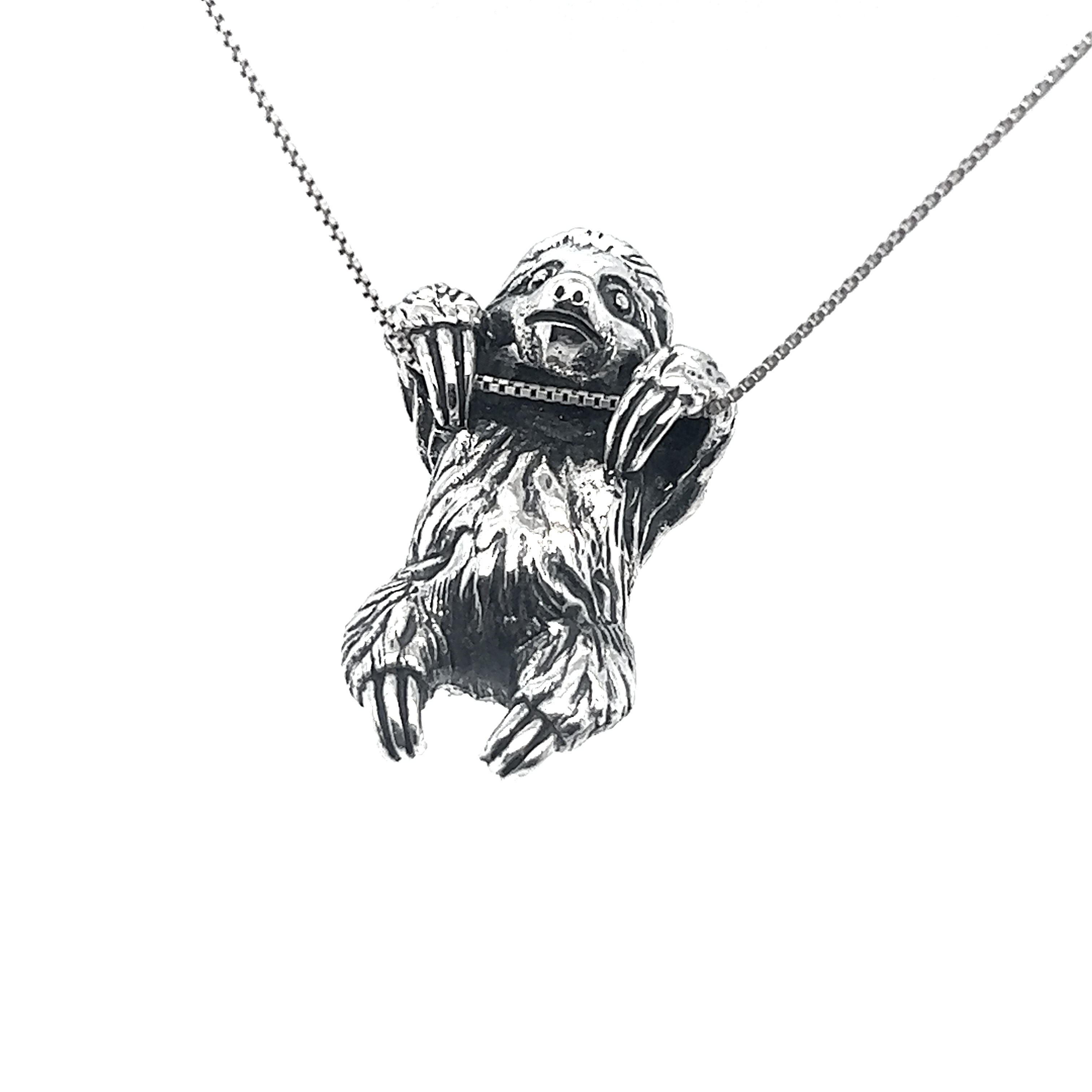 An intricately crafted Super Silver sloth pendant, part of an artisan collection, delicately hangs from a chain on this necklace.