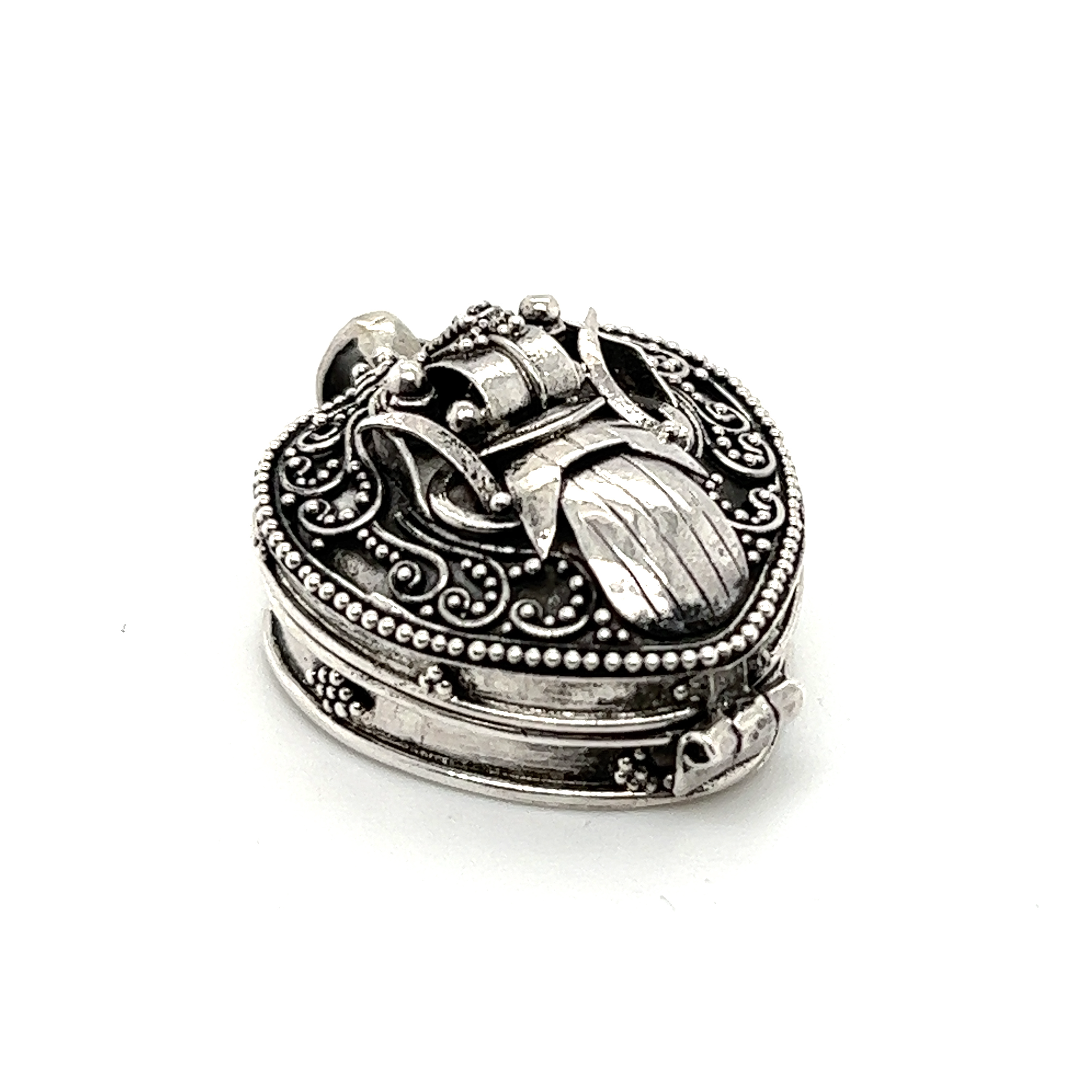 A Bali Heart Shaped Prayer Box Pendant by Super Silver on a white background.