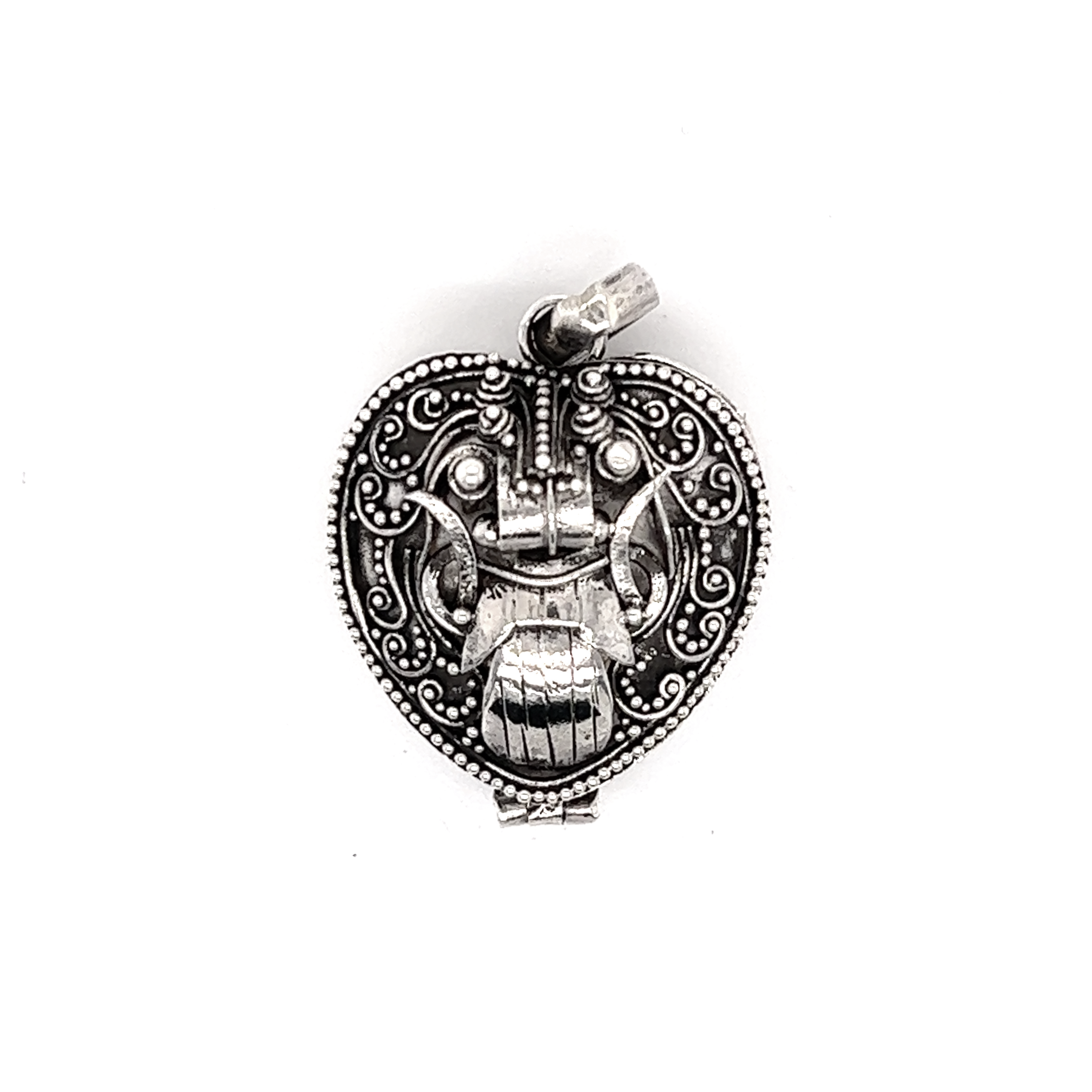 A Bali Heart Shaped Prayer Box Pendant with a vintage-style design.