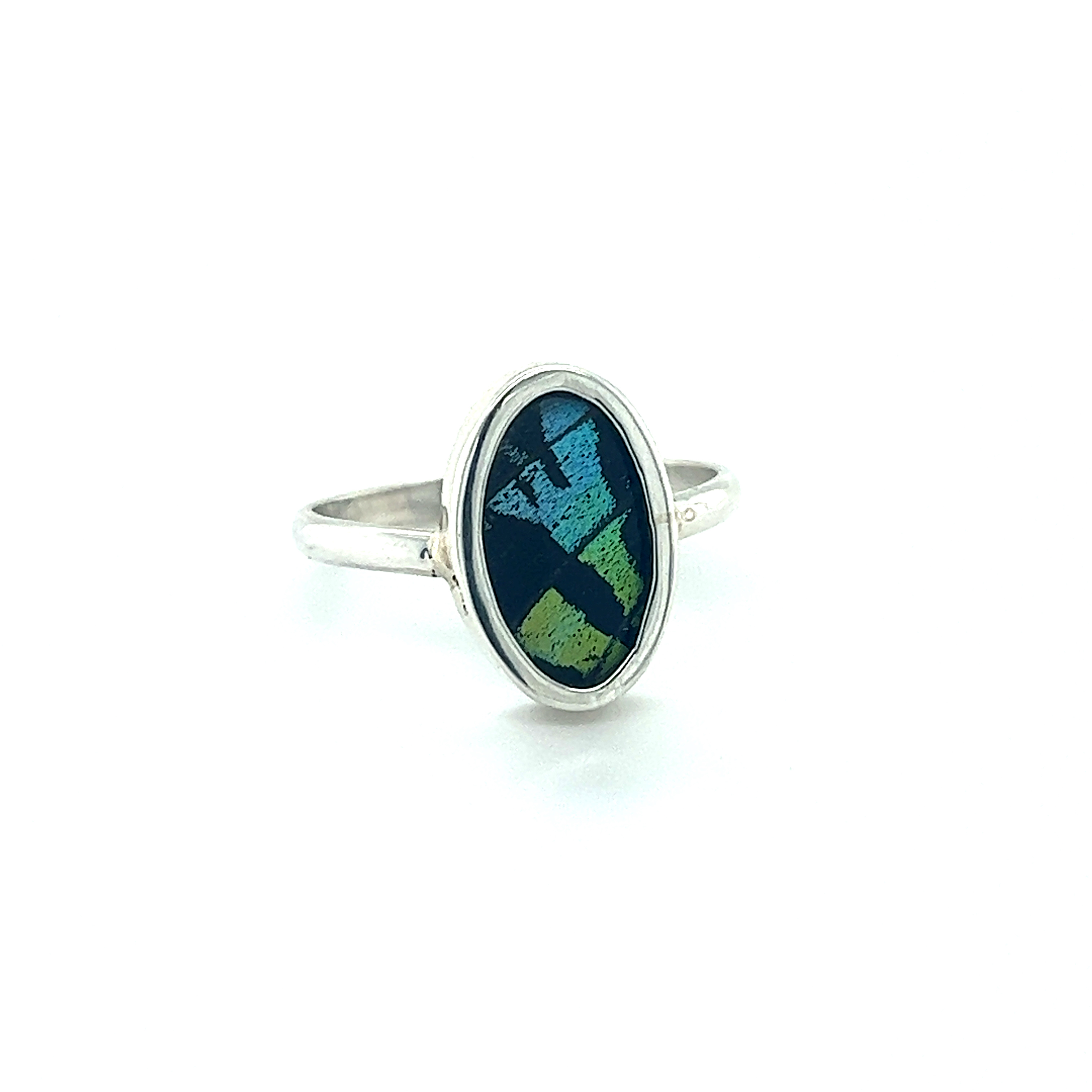 A stunning silver Genuine Butterfly Wing Ring in Oval Shape adorned with a mesmerizing green and blue opal.