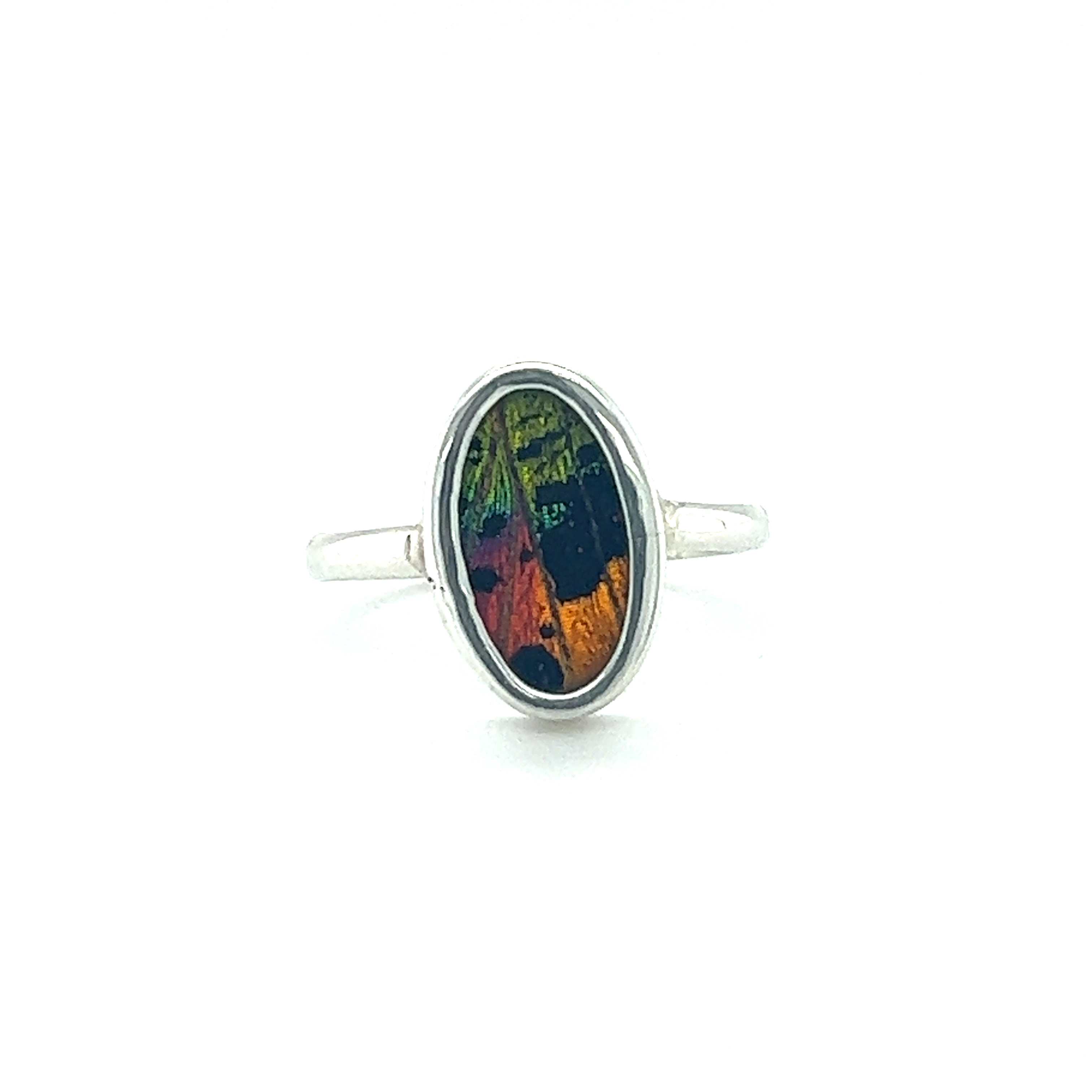 A Genuine Butterfly Wing Ring in Oval Shape with a vibrant and intricate design.