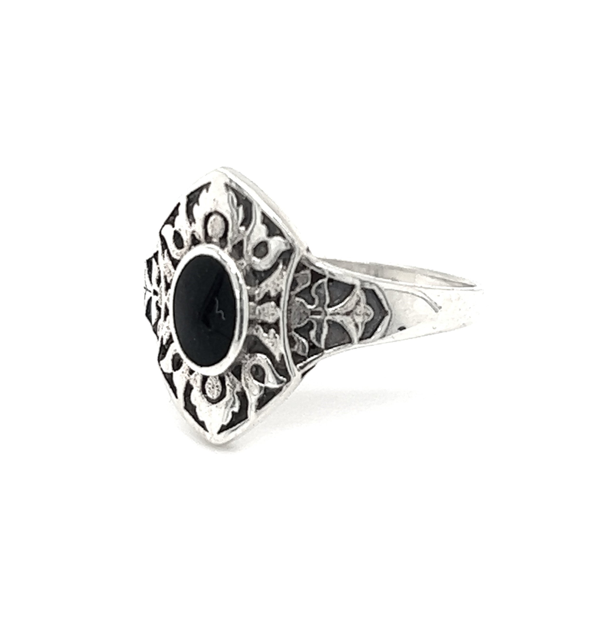A Marquise Shield Ring With Inlaid Stones with a black onyx stone inlaid.