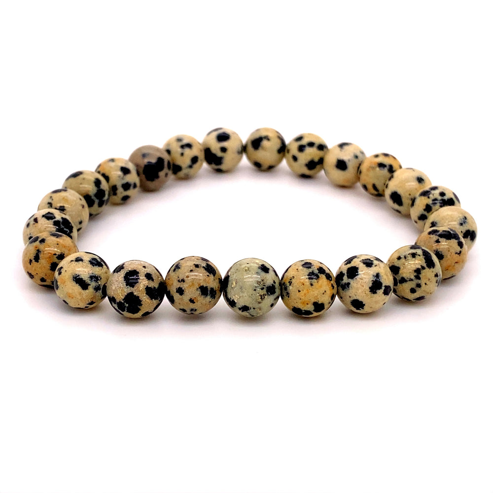 
                  
                    A 4mm Beaded Stone Bracelet made of dalmatian jasper beads, showcasing a pattern of black and brown spots on a white background, designed as a stackable gemstone bracelet.
                  
                
