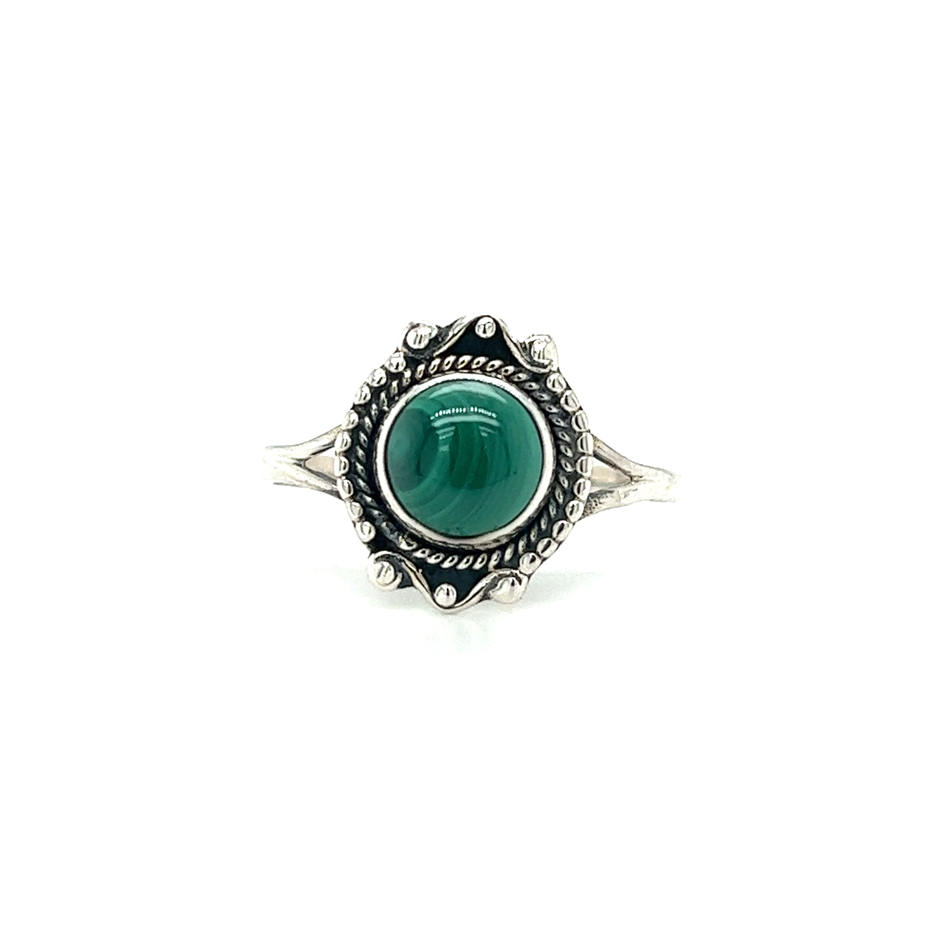 A Round Gemstone Ring With Vintage Setting crafted from sterling silver, featuring an ornate design with a large green gemstone at its center, embodying Bohemian jewelry elegance.