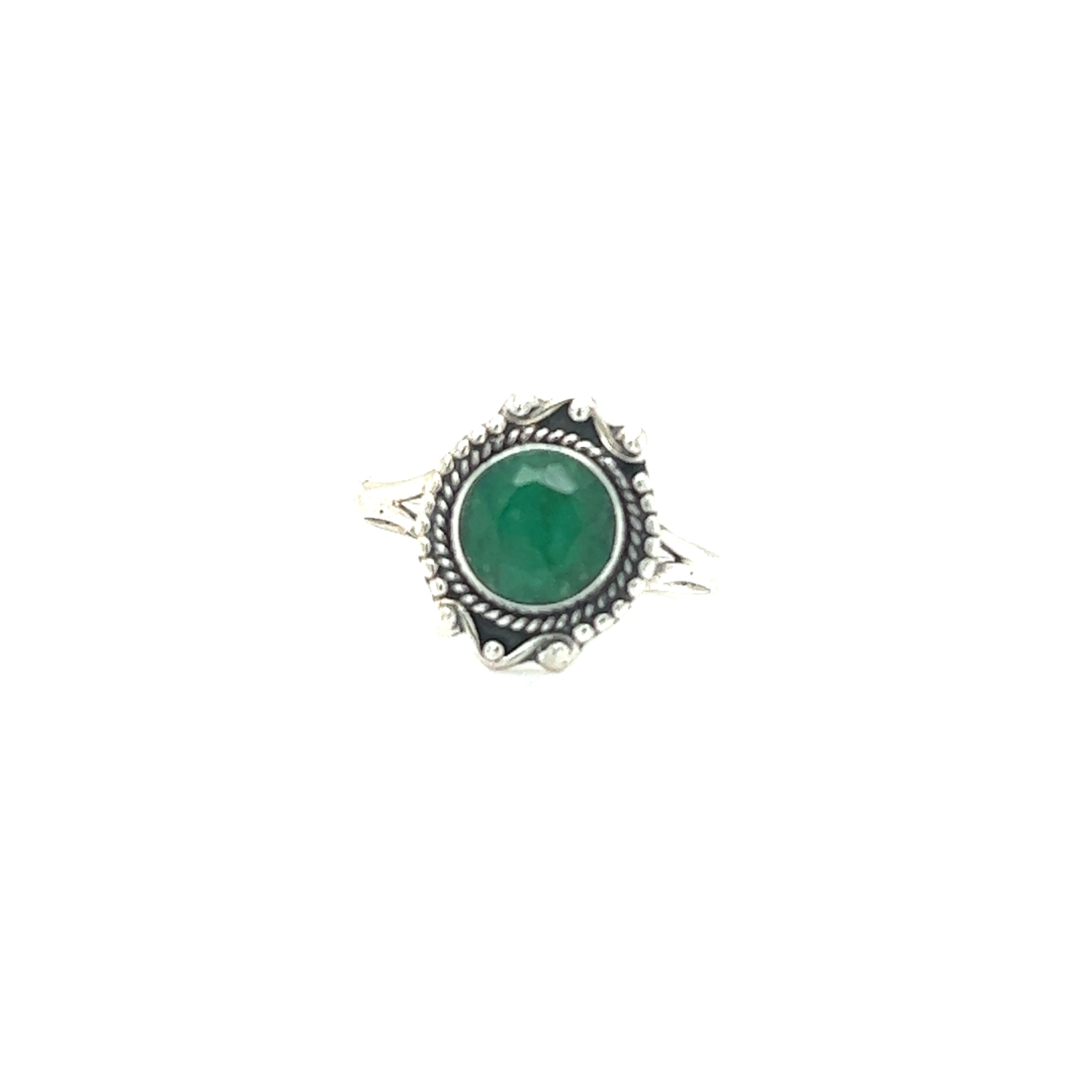 A Round Gemstone Ring With Vintage Setting crafted from .925 Sterling Silver, featuring a round, green gemstone set within an ornate bezel with bohemian sophistication and small decorative accents around the stone.