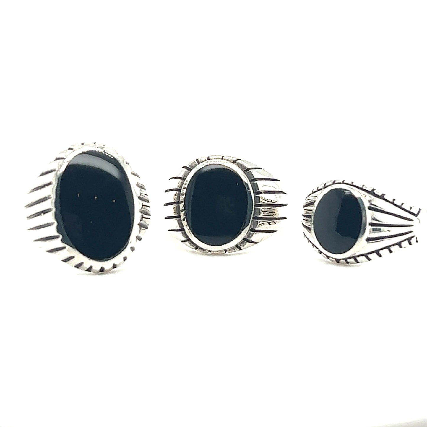 Three Oval Onyx Rings With Fine Oxidized Scale Pattern.