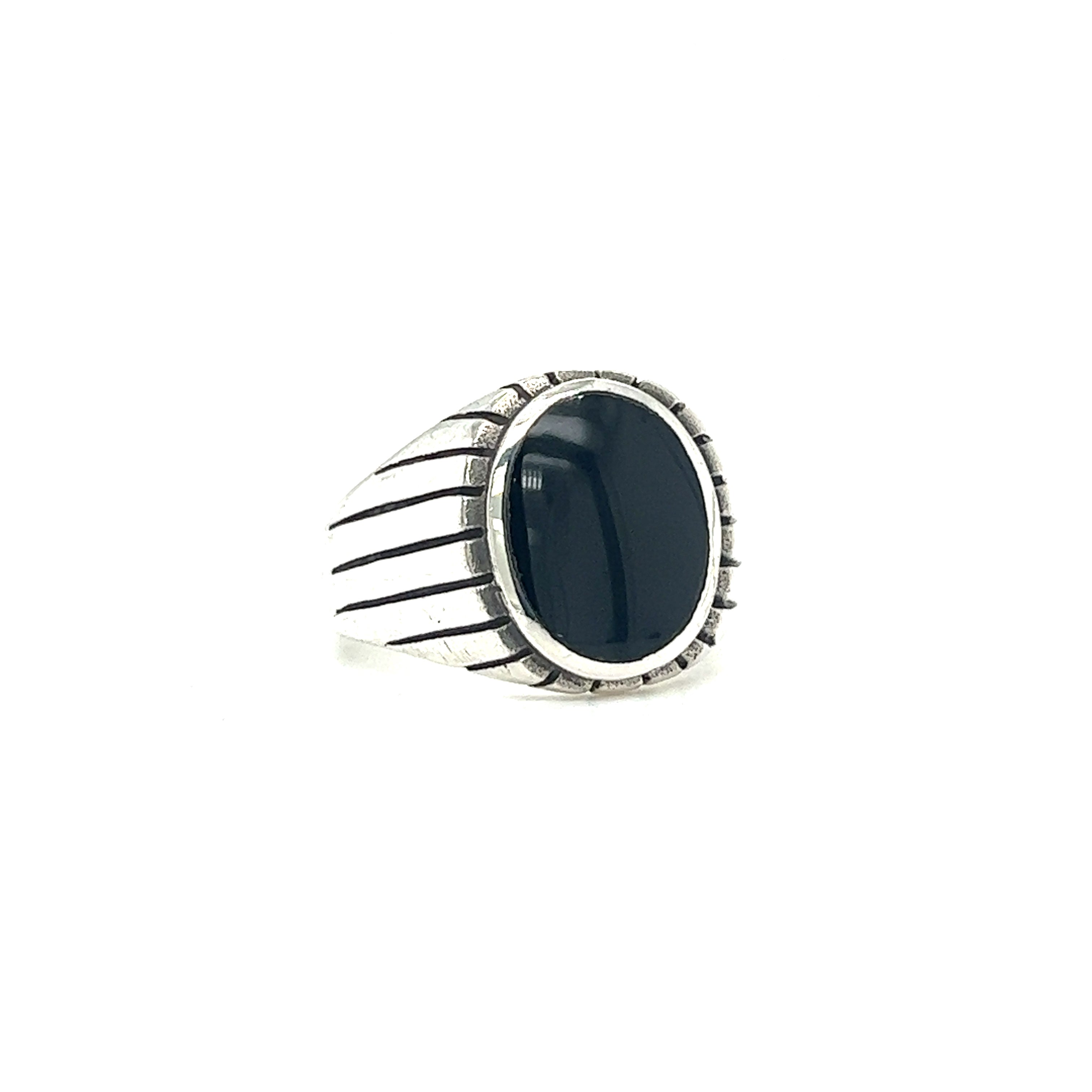 An Oval Onyx Ring With Fine Oxidized Scale Pattern with a black stone in the middle.