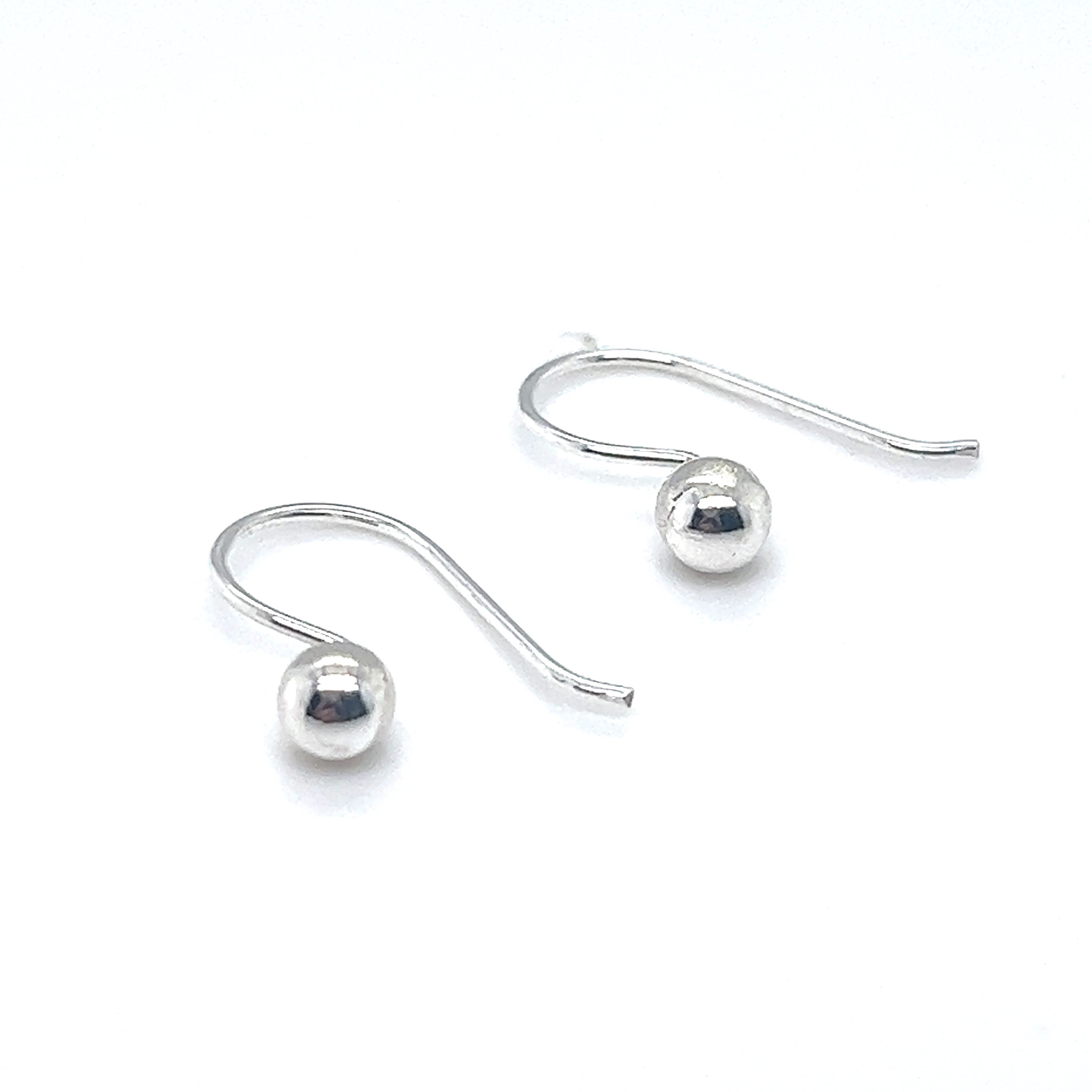 Super Silver's Dainty Fixed Ball Earrings on a white background, exuding timeless minimalism.