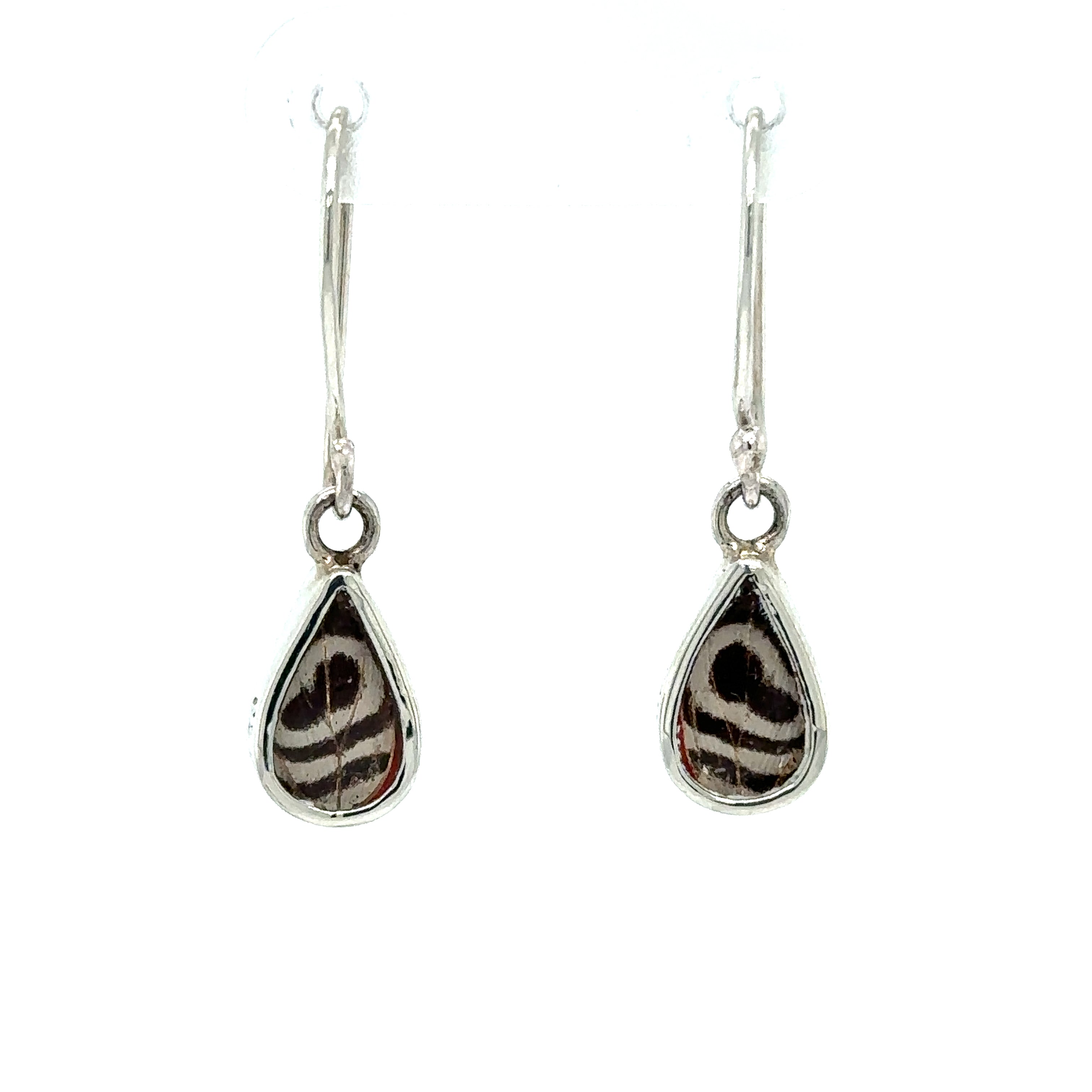 A statement pair of Small Butterfly Wing Earrings with a black and white pattern.