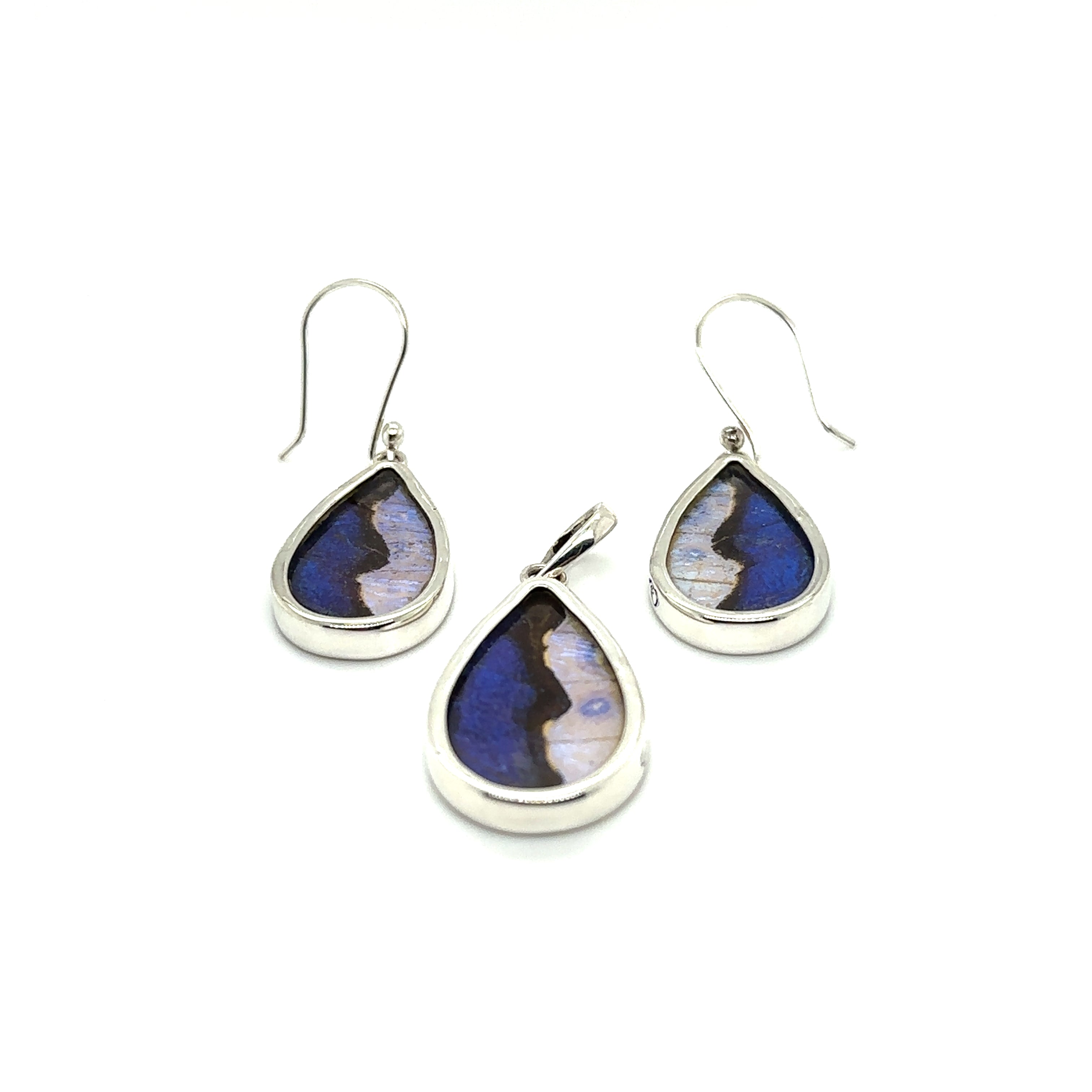 A pair of Genuine Butterfly Pendant and Earring Teardrop Set with a statement blue tear-shaped stone.