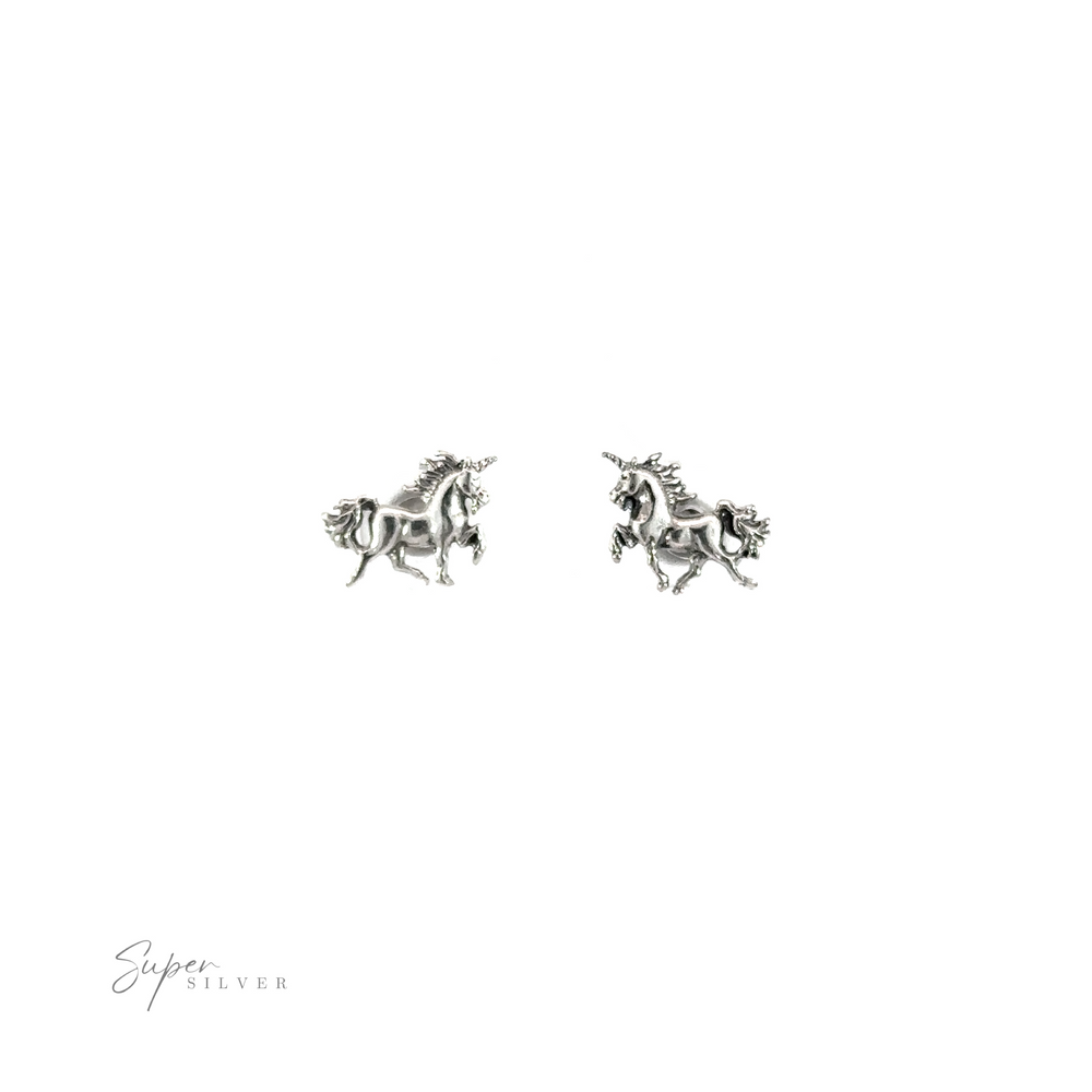 
                  
                    A pair of silver Unicorn Studs on a white background.
                  
                