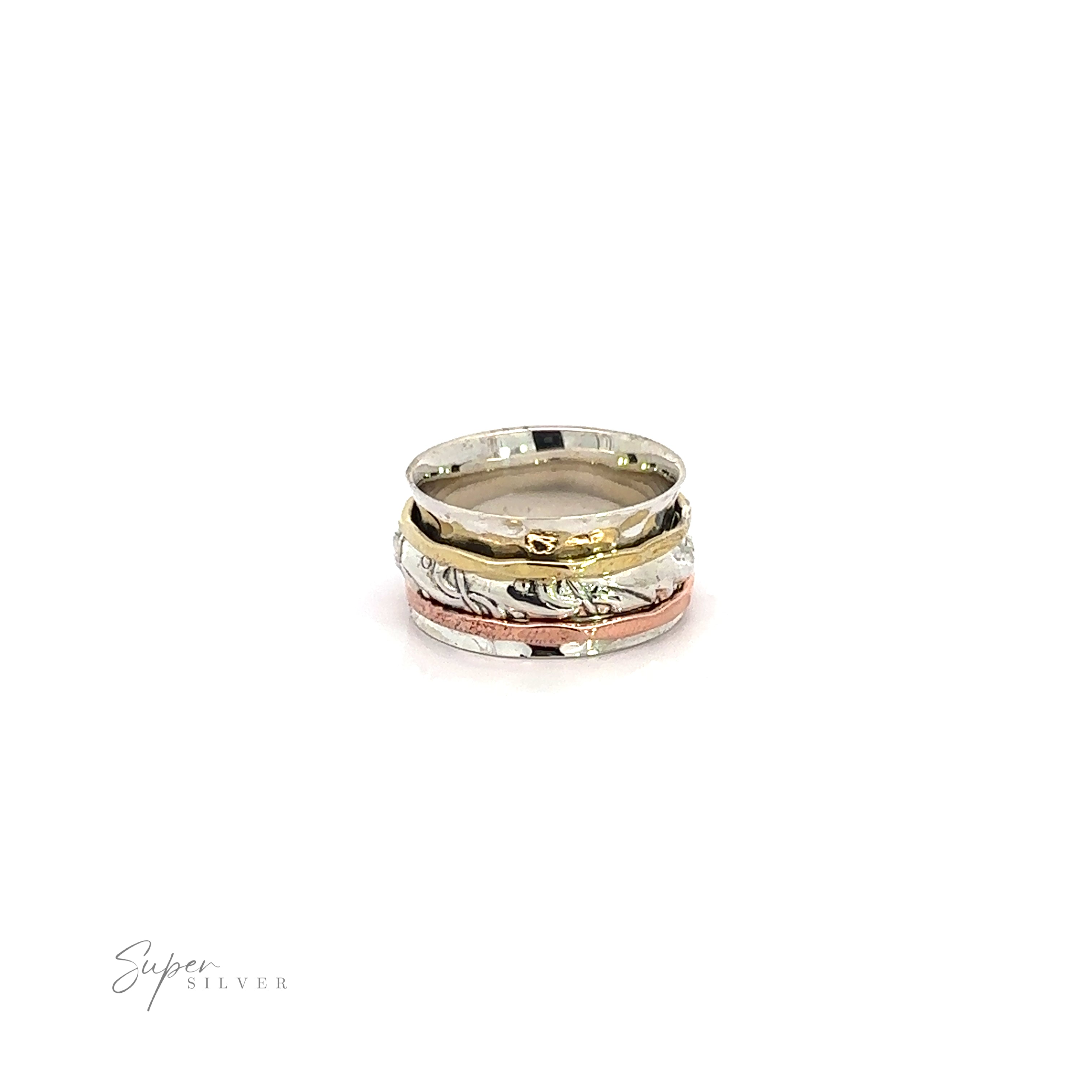 A stack of Handmade Spinner Rings with a Filigree Pattern Band, featuring a delicate filigree pattern and a hammered tricolor ring, set against a pristine white background.