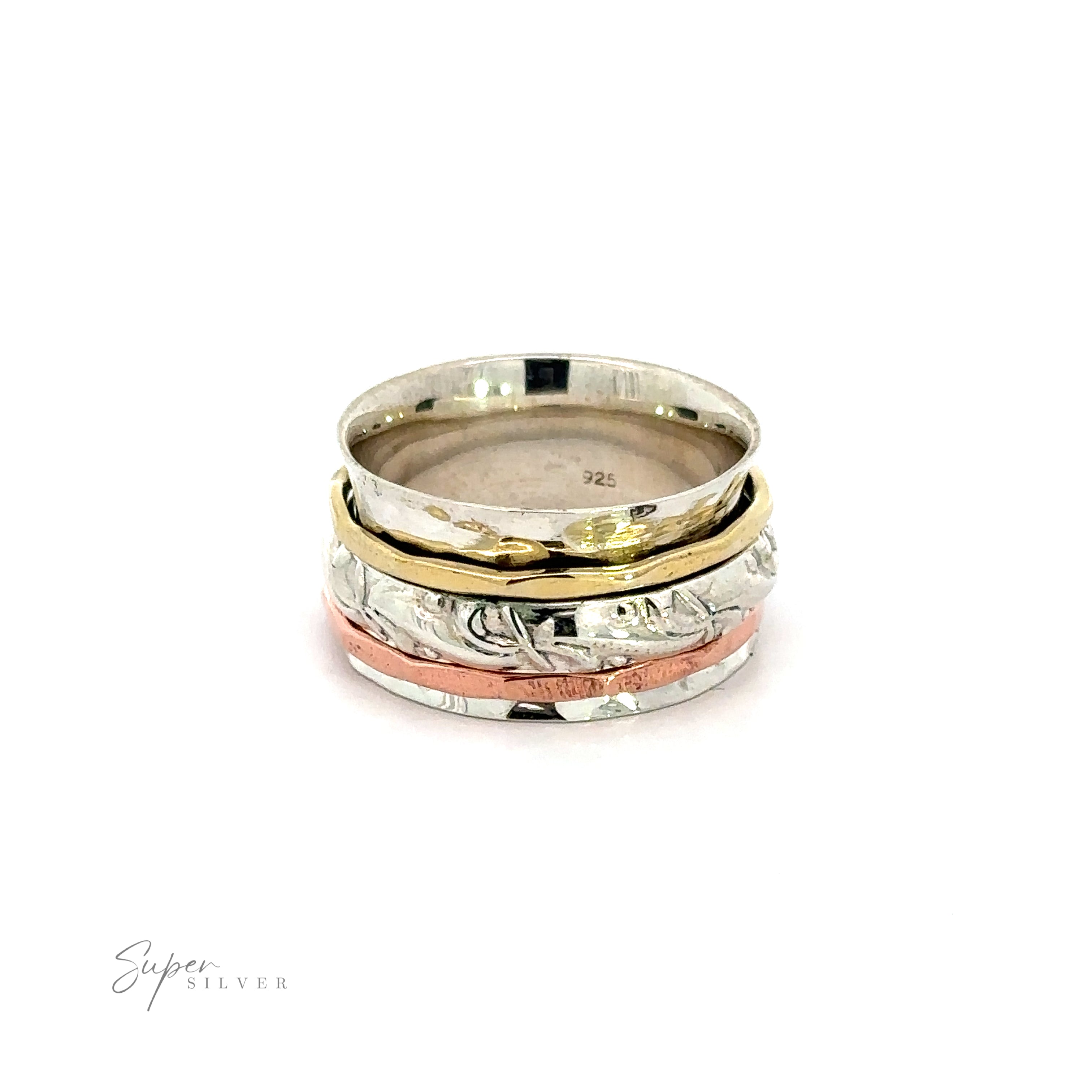 A stack of Handmade Spinner Rings with a Filigree Pattern Band in silver and gold, featuring a hammered tricolor design, beautifully displayed on a white background.