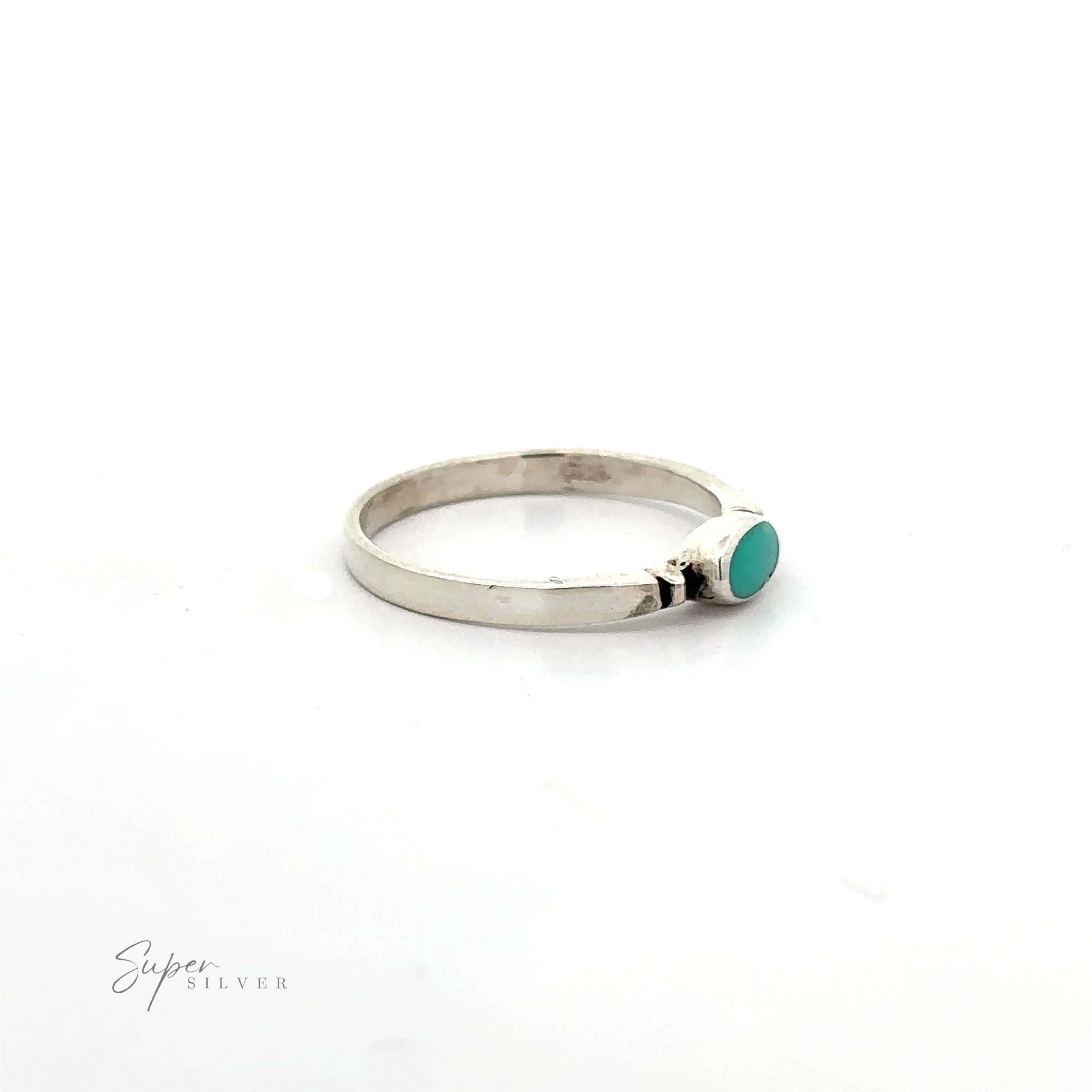 A dainty and sleek sterling silver Small Horizontal Oval Inlay Ring with a sideways oval turquoise stone.