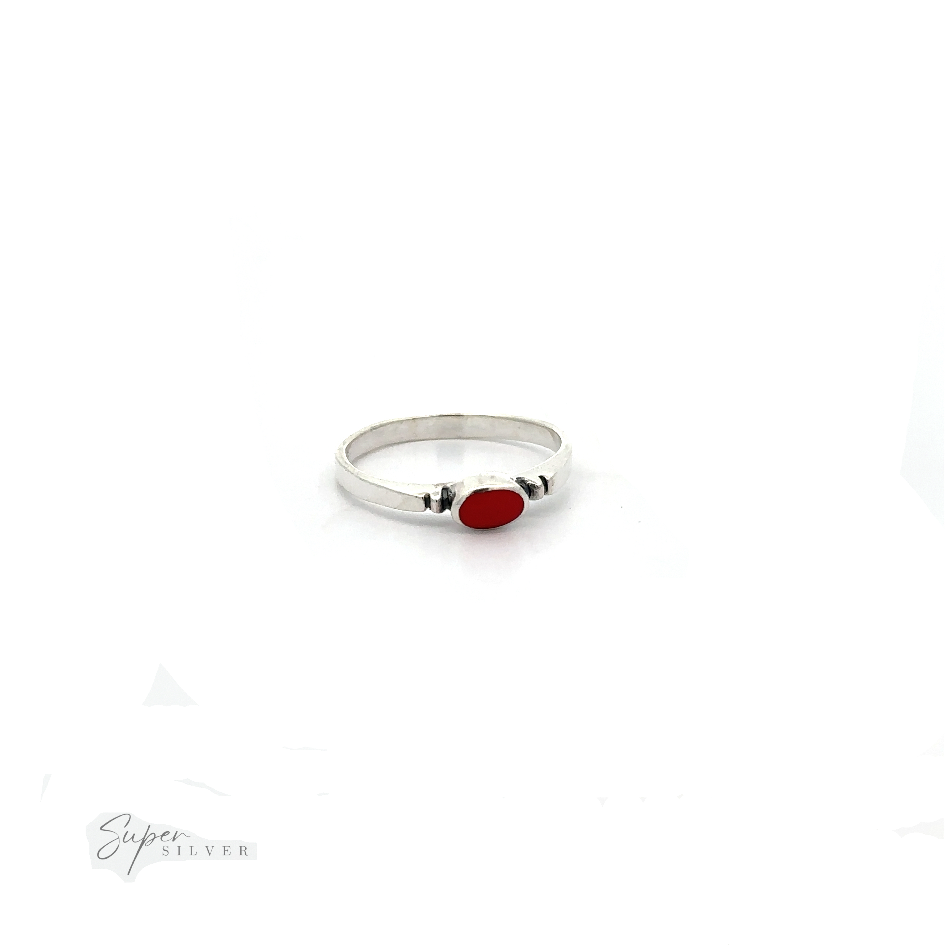 A dainty and sleek Small Horizontal Oval Inlay Ring with a red stone.