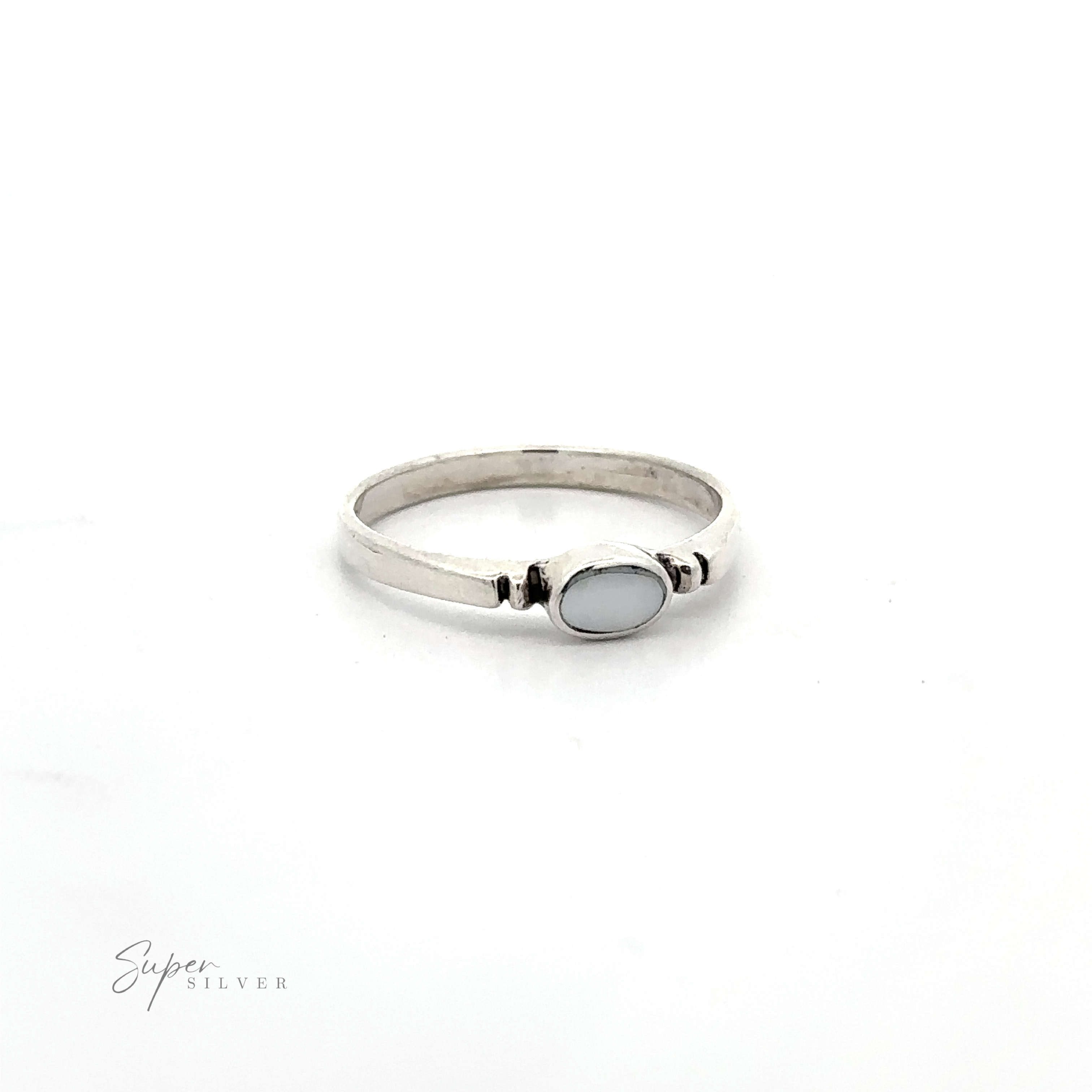 A dainty sterling silver Small Horizontal Oval Inlay Ring with a sleek design and a blue stone.