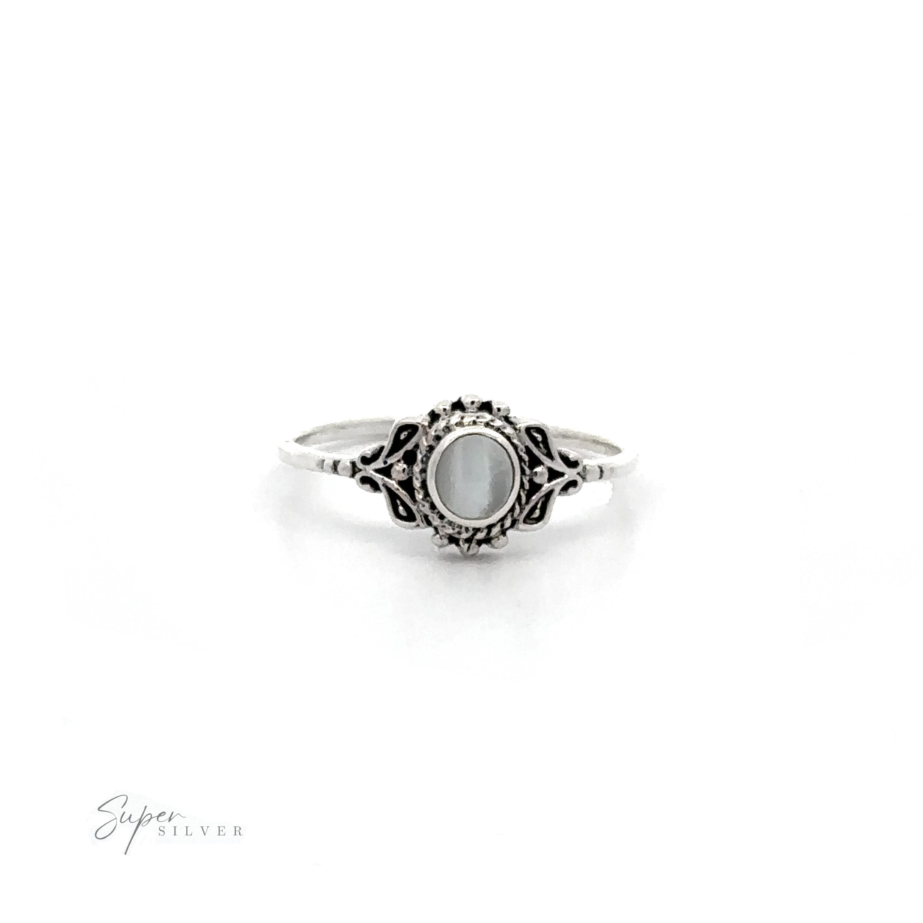 A Dainty Inlaid Stone Ring with Filigree in sterling silver with a white stone.