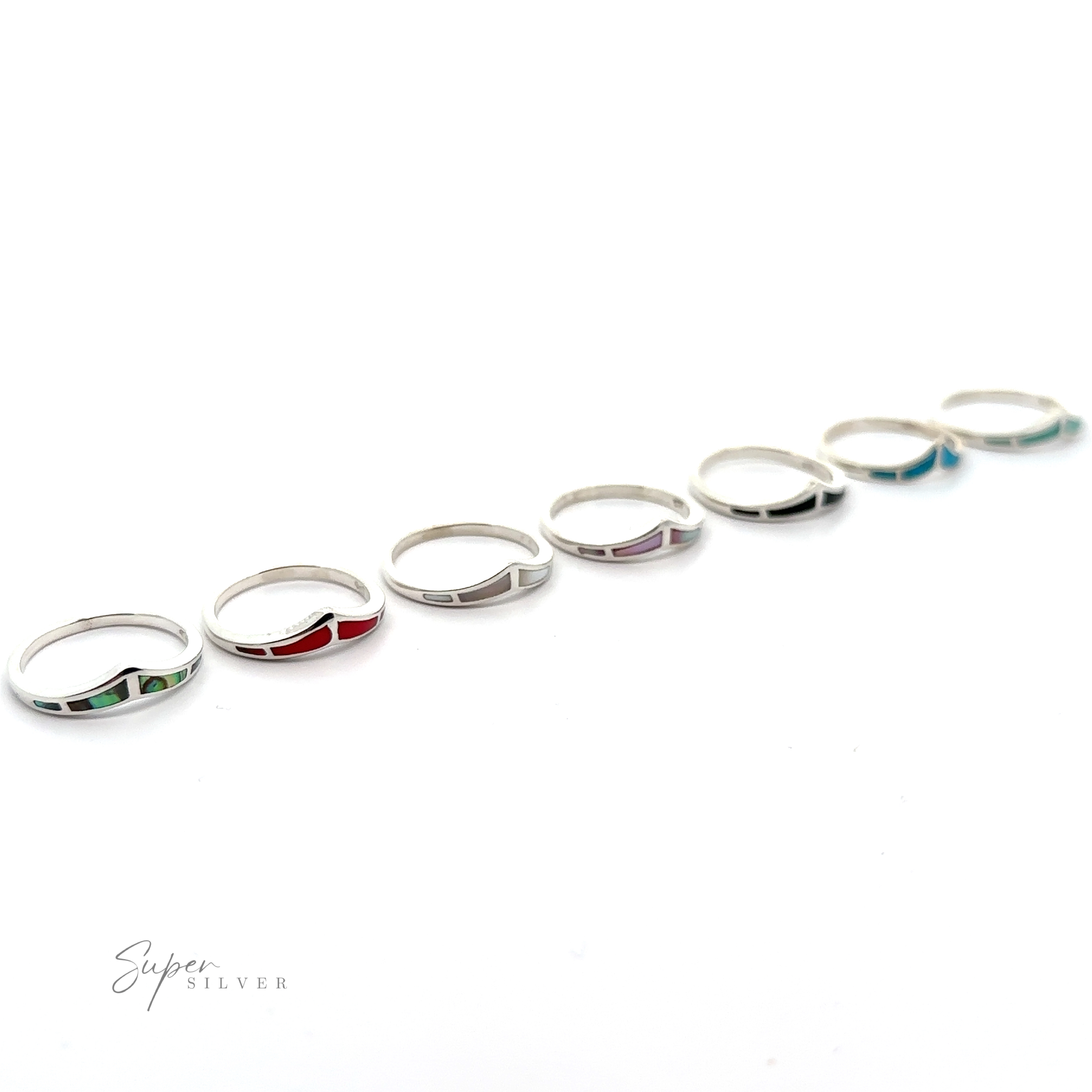 A row of Trendy Chevron Rings with inlaid stone accents.