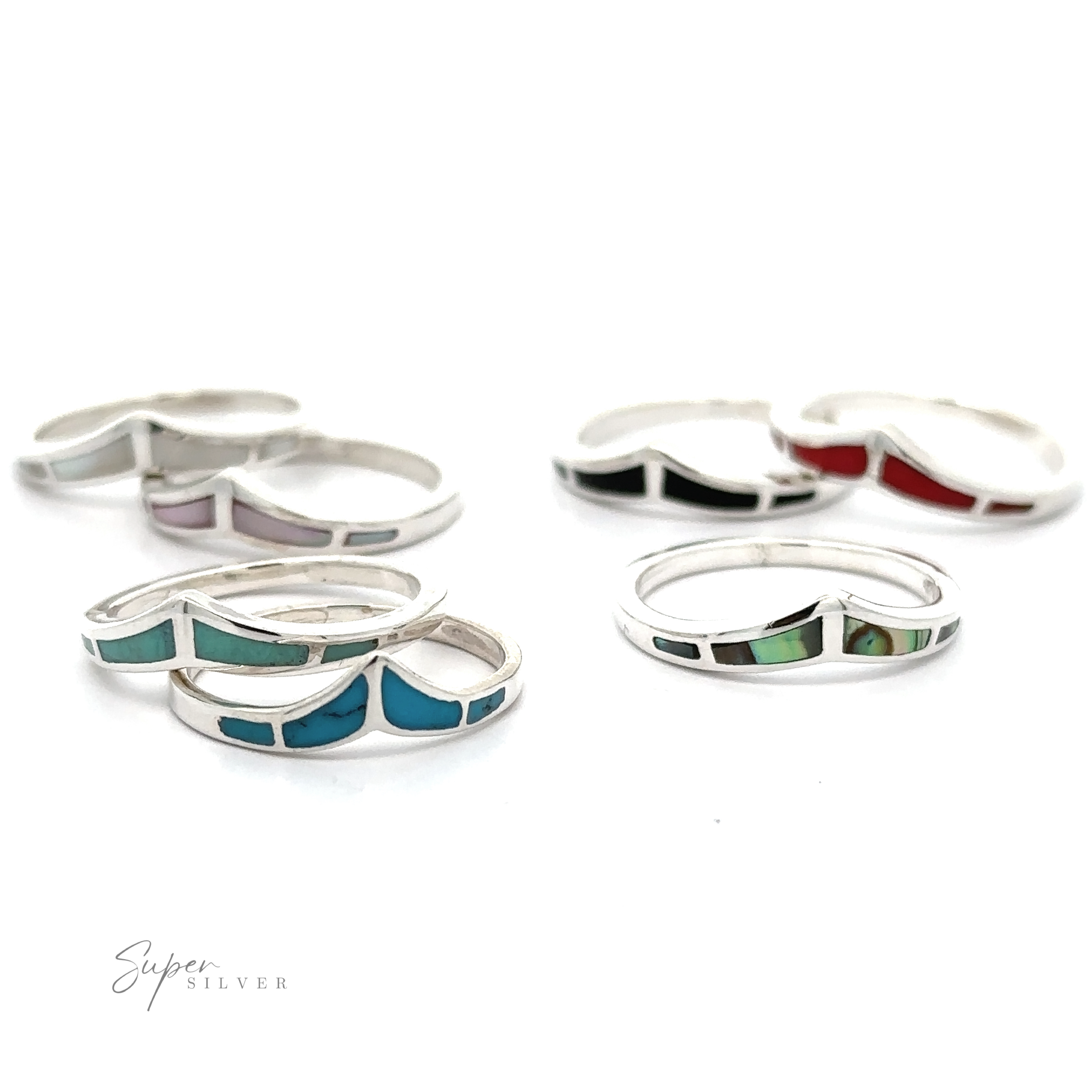 A set of trendy chevron rings with inlaid stones.