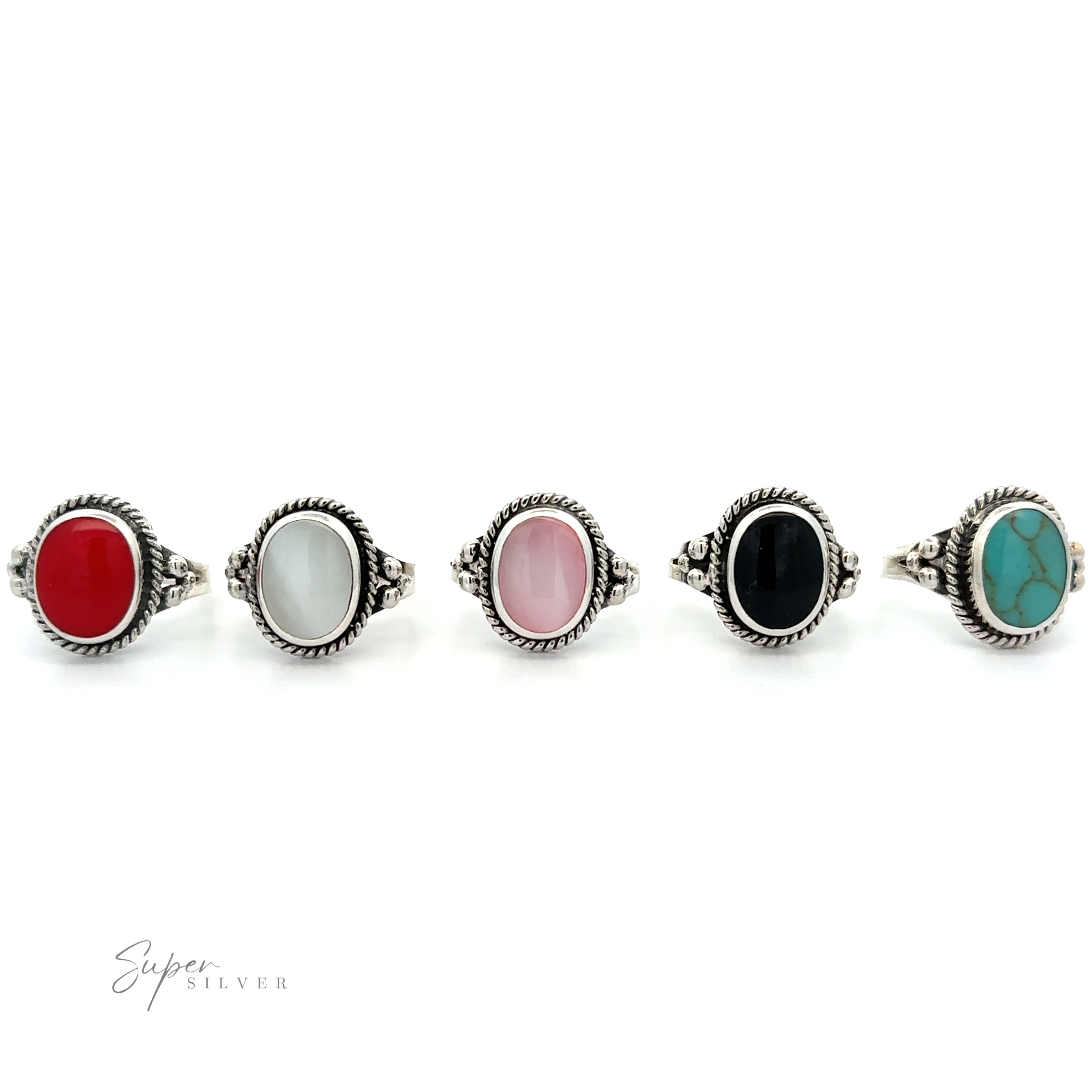 Four Oval Rings with Rope Setting and Inlaid Stones on a white background.