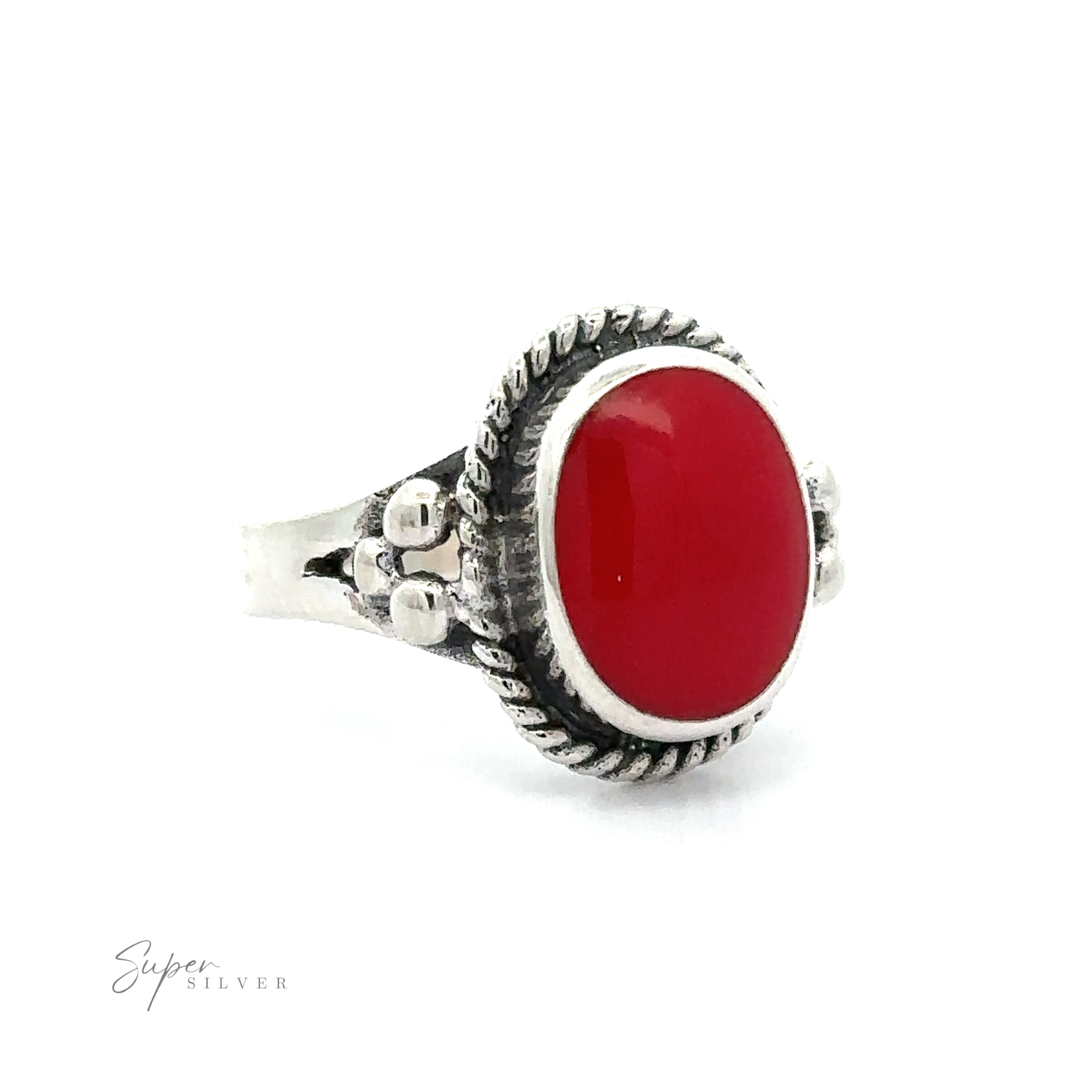 A red Oval Ring with Rope Setting and Inlaid Stones on a white background.