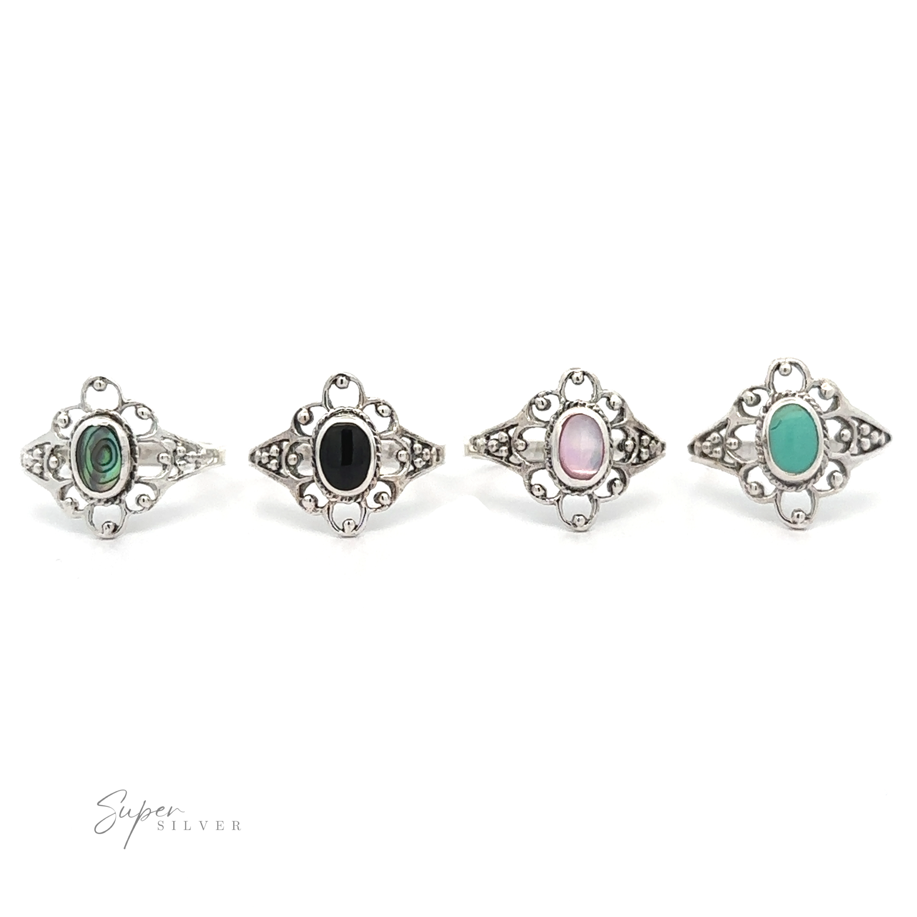 A set of four Vintage-Styled Flower Rings with Inlaid Stones, combining vintage appeal and lacey petals.