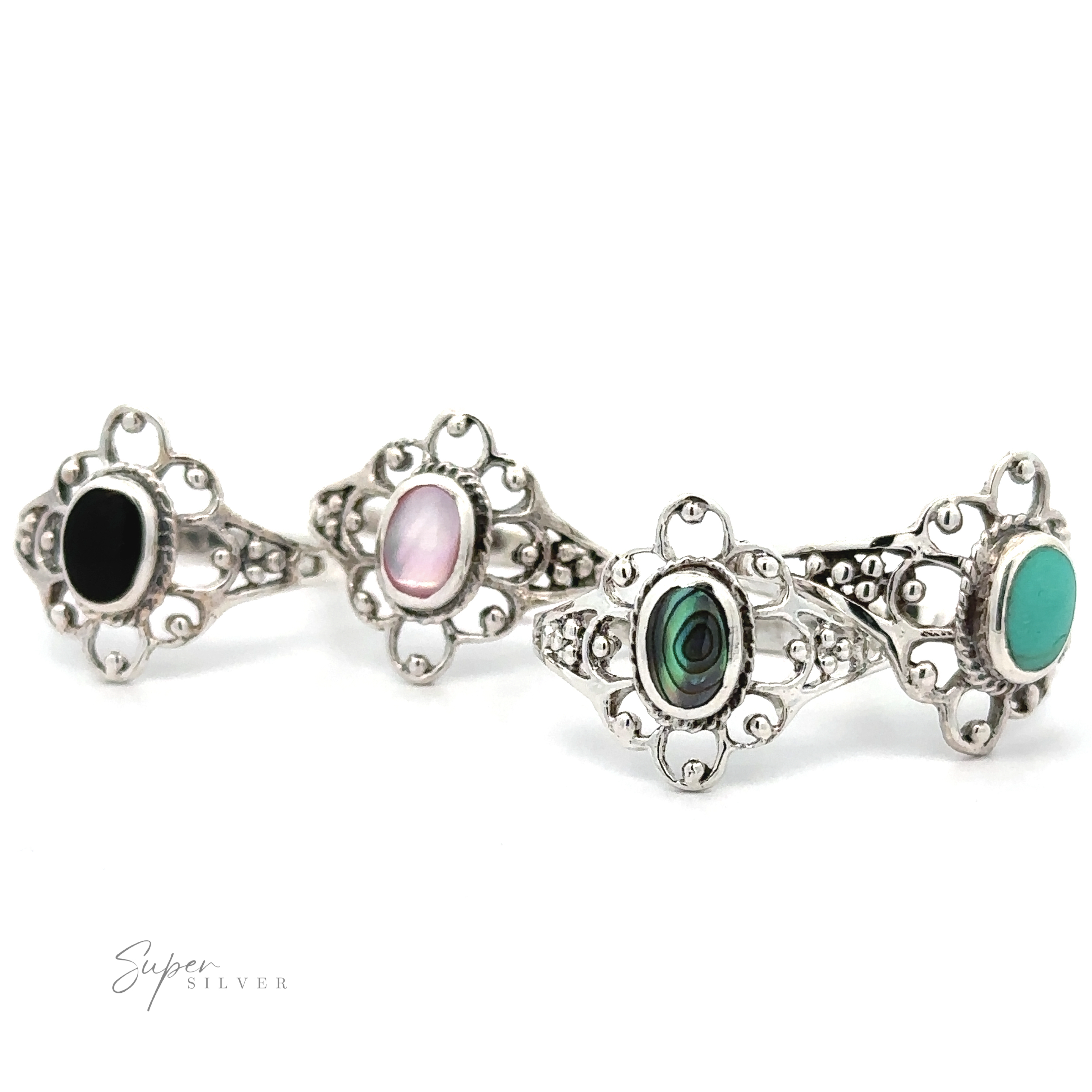 A set of four Vintage-Styled Flower Rings with Inlaid Stones.