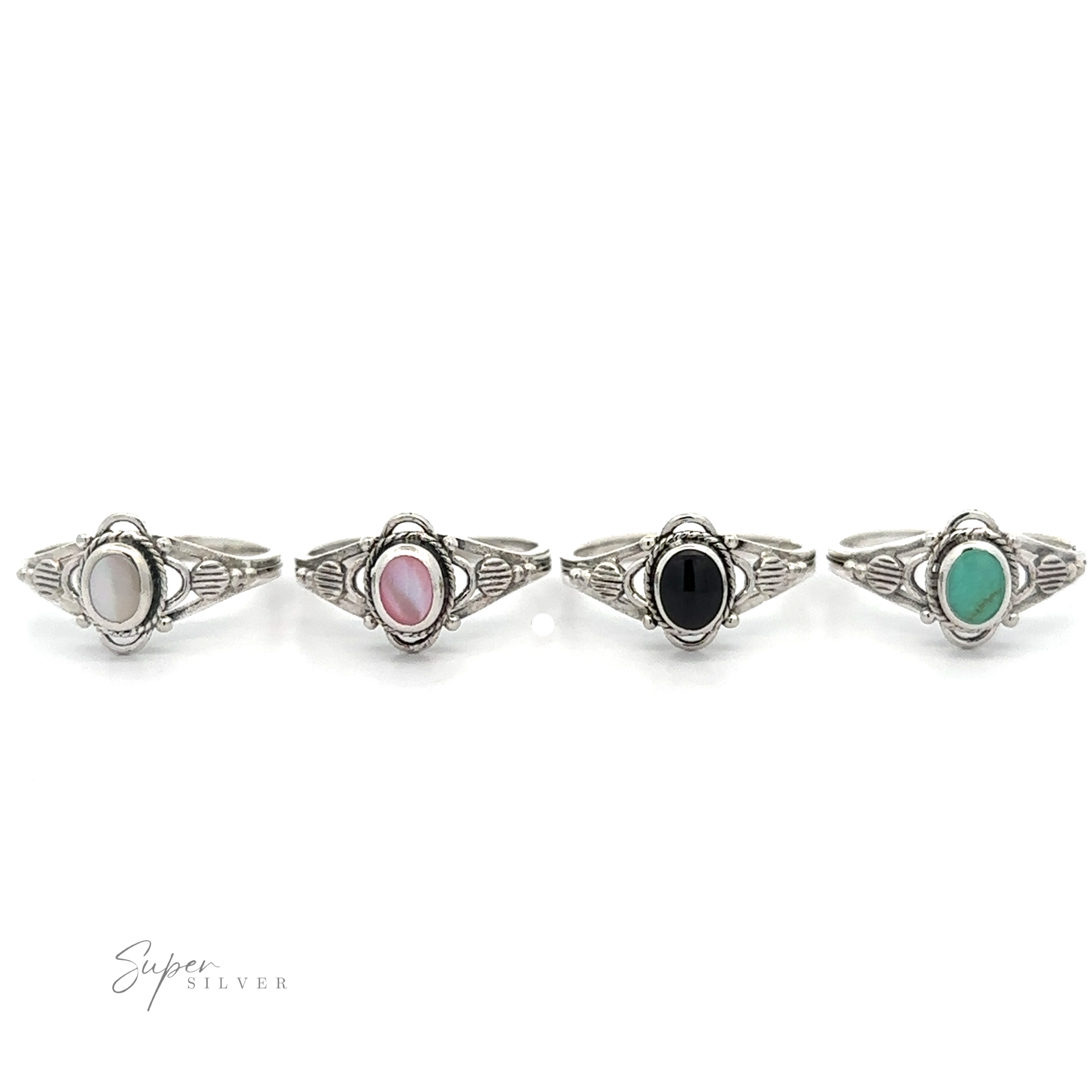 Four Fancy Oval Inlay Stone Rings with mother-of-pearl and vintage flower motif designs on a white background.