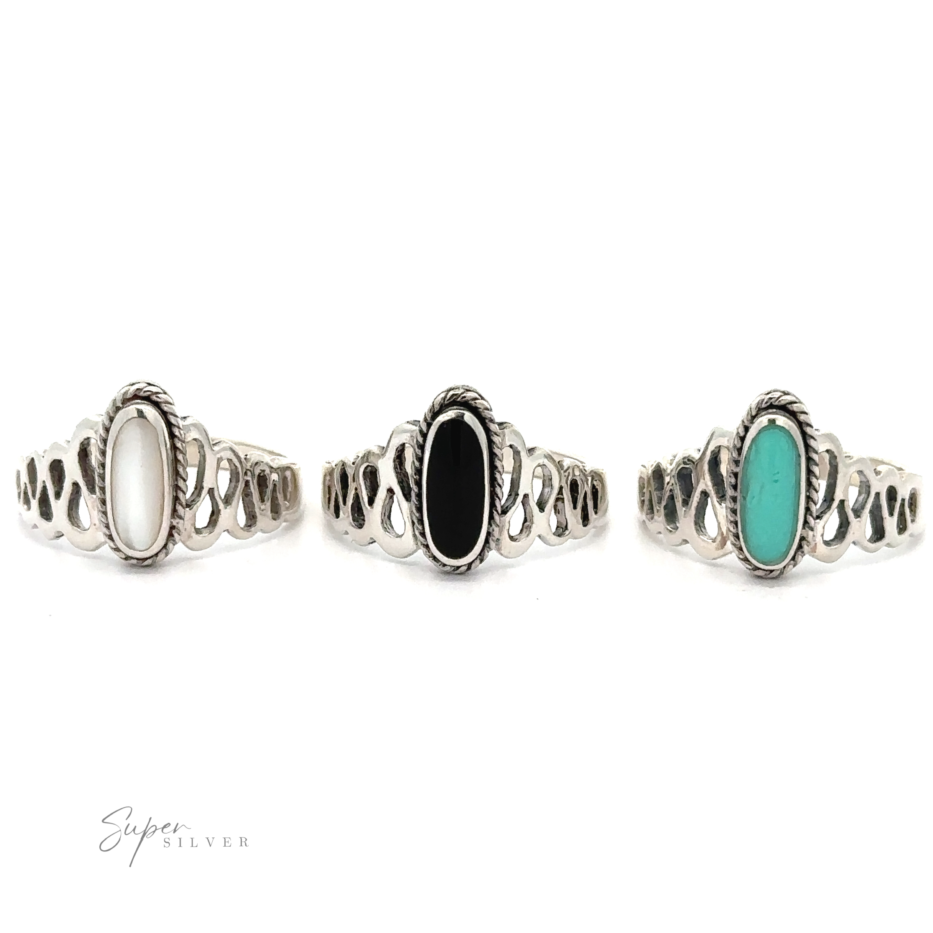 Three Oval Inlaid Stone Rings with turquoise and black inlaid stones.