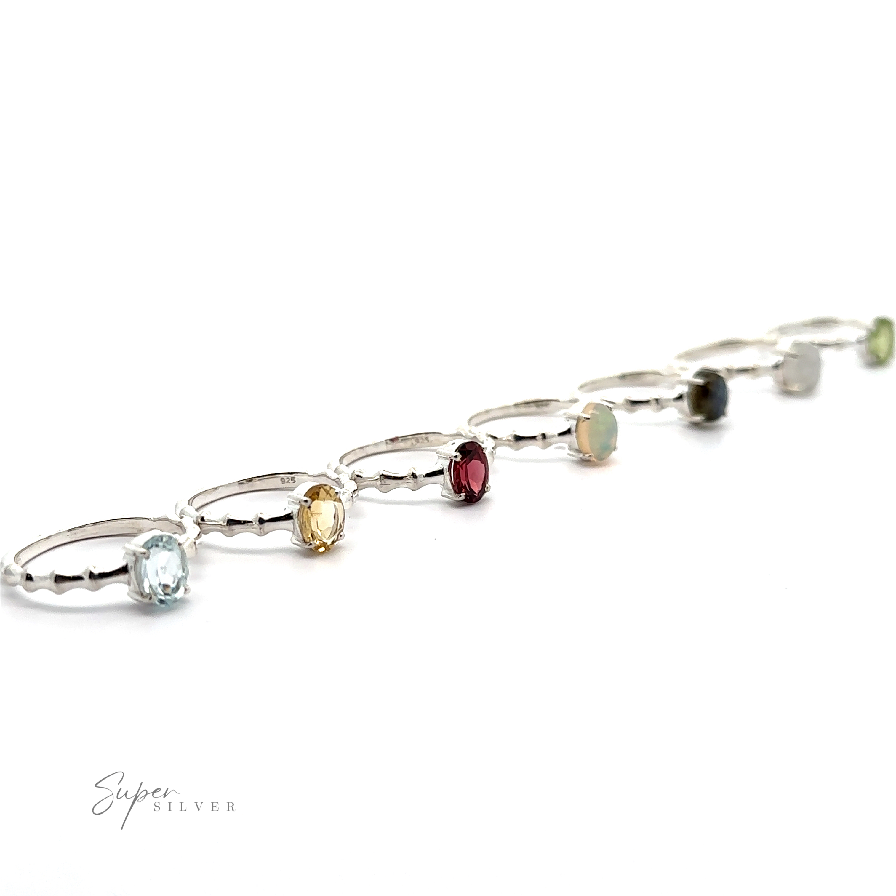 A Pronged Oval Gemstone Ring with Textured Band on a white background.