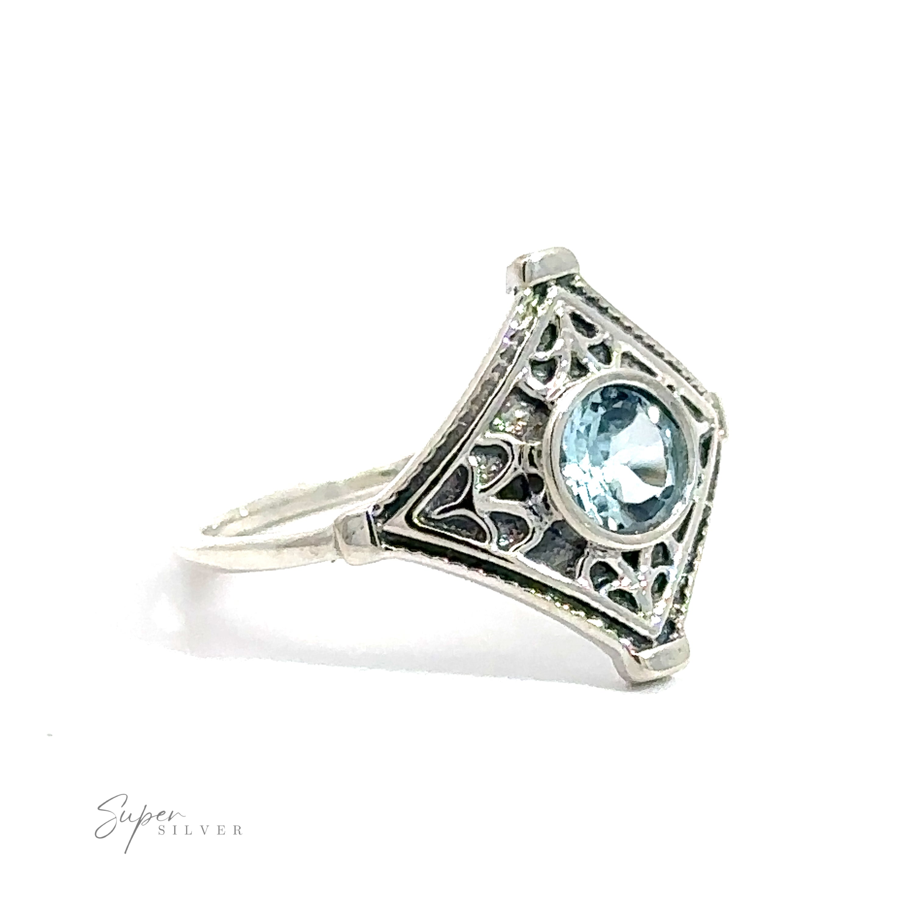 A Intricate Diamond Silver ring with a round aquamarine gemstone, displayed against a white background.
