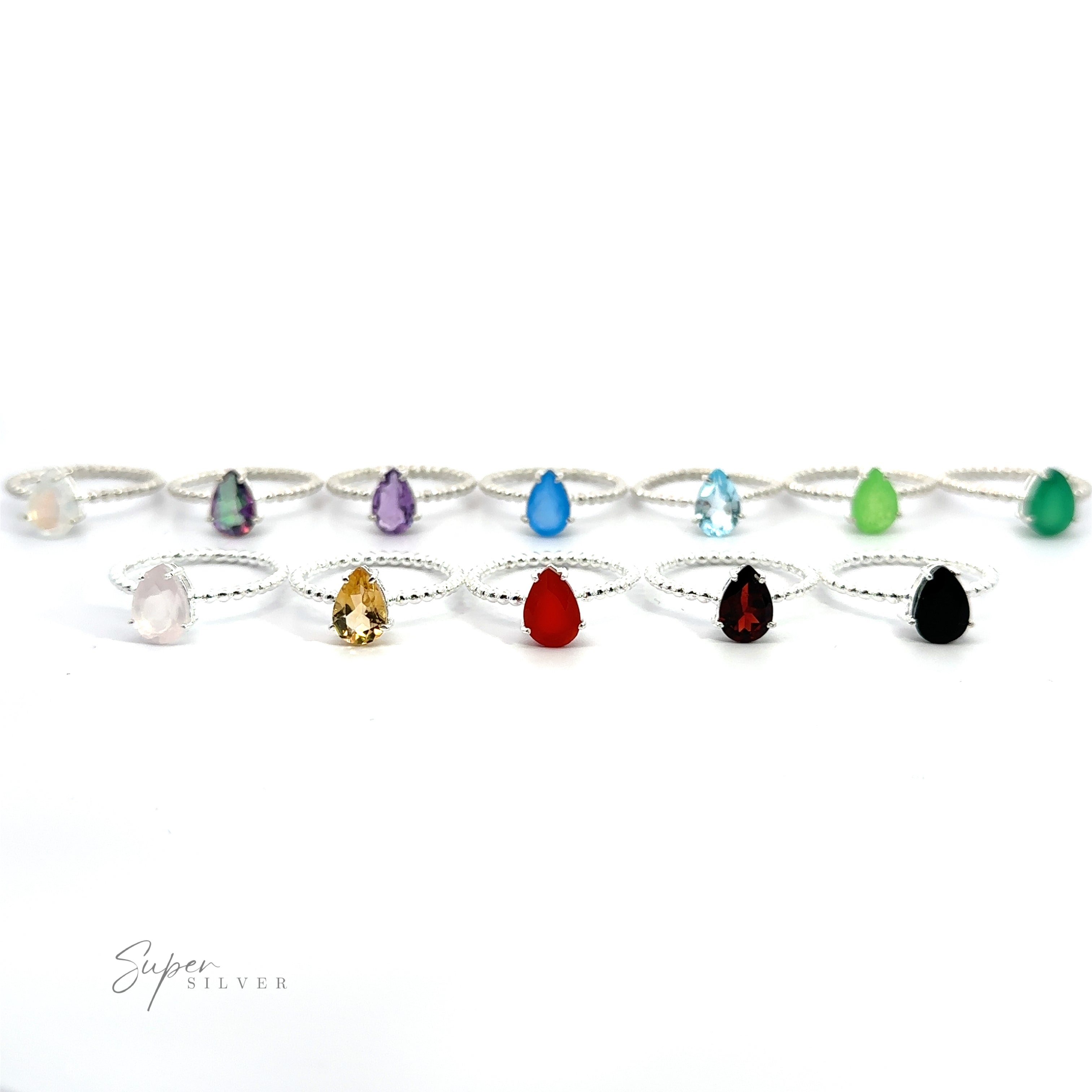 A collection of Vibrant Teardrop Gemstone Rings with Beaded Bands displayed in a row against a white background.
