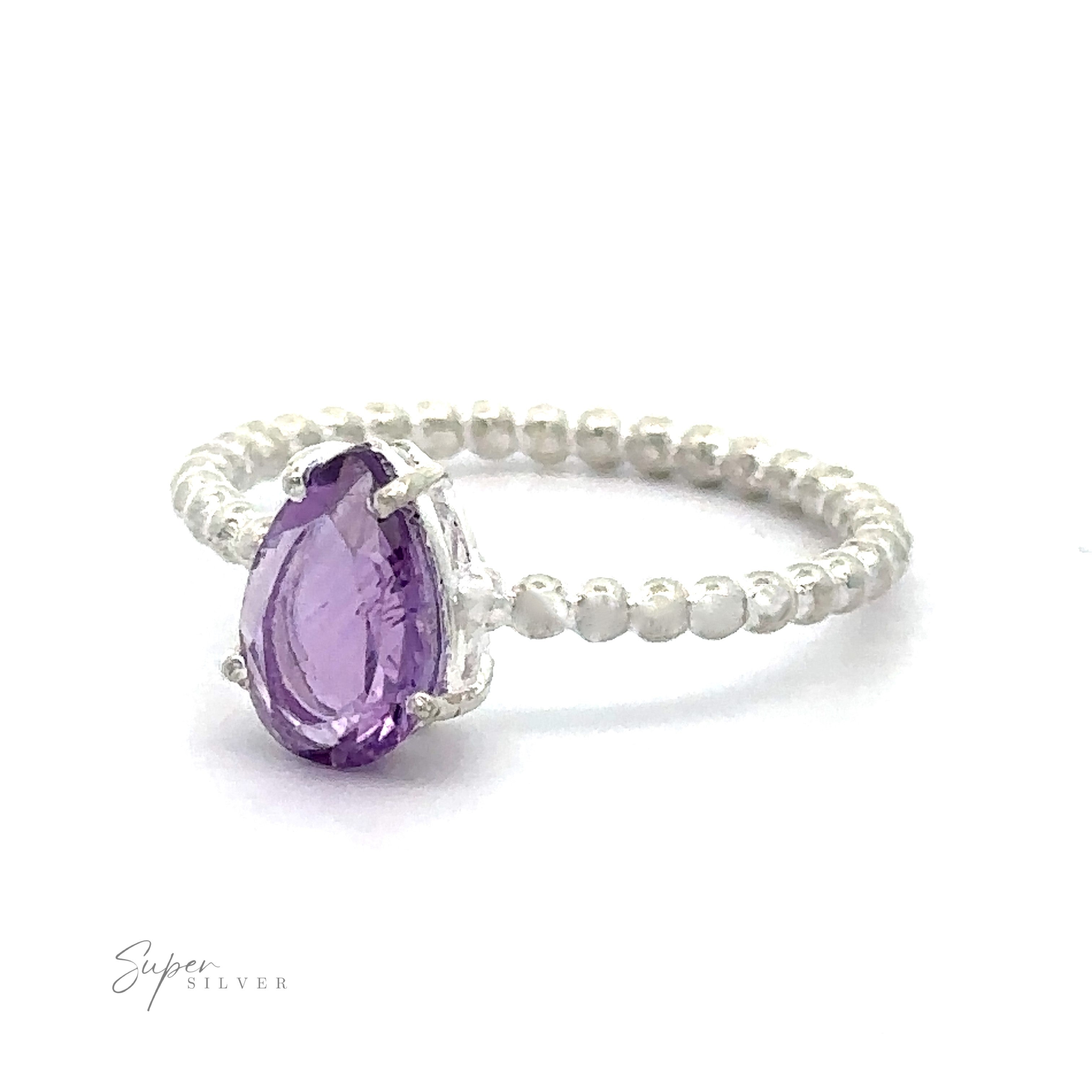 Vibrant teardrop gemstone ring with beaded band and a prong setting for the amethyst center stone.
