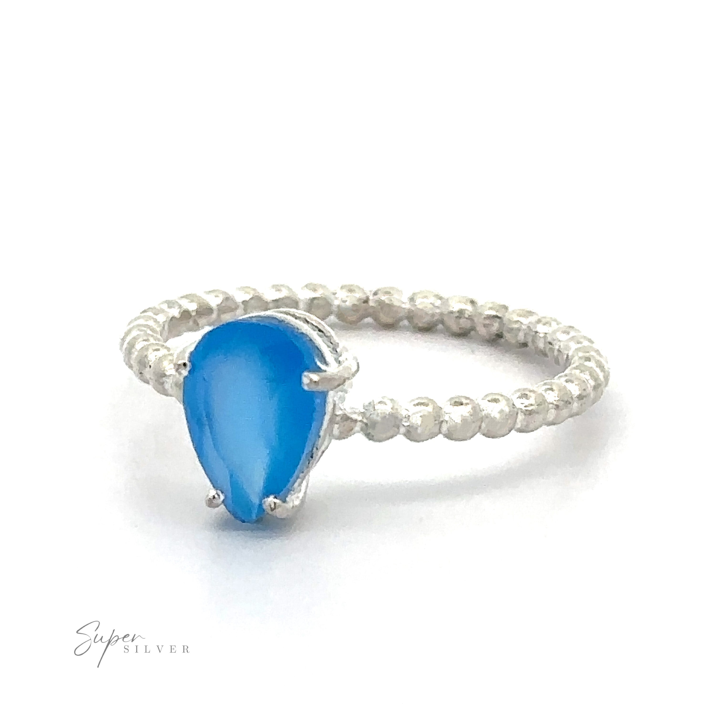 Vibrant Teardrop Gemstone Ring with Beaded Band ring with a blue teardrop gemstone in a prong setting on a white background.