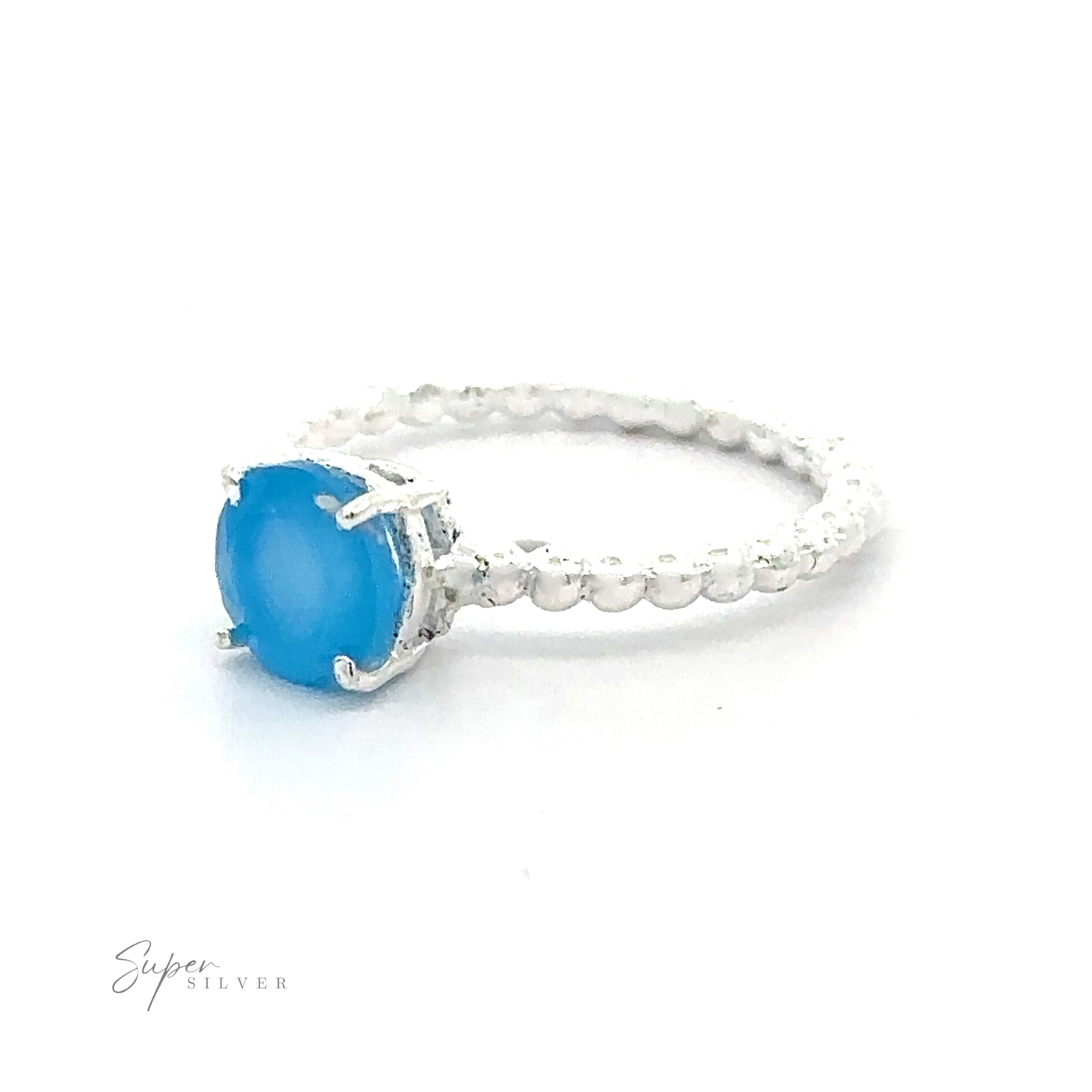 Stunning Circular Gemstone Ring with Beaded Band Small Sizes with a vibrant blue gemstone on a white background.